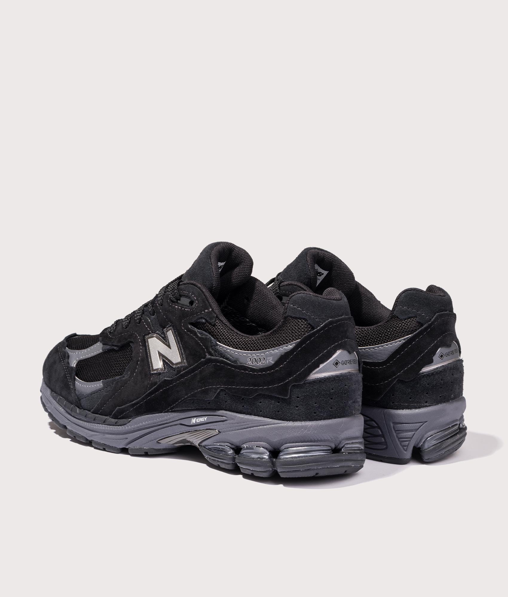 2002DX Sneakers in Black | New Balance | EQVVS | Back angle shot 