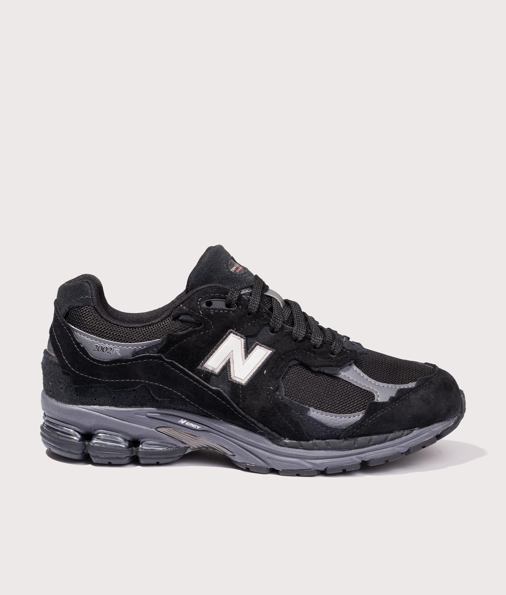 2002DX Sneakers in Black | New Balance | EQVVS | Side shot 