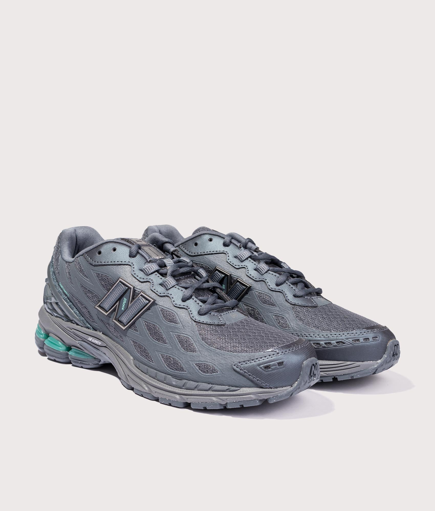 New Balance 1906WV1 Reflective Sneakers in Graphite at EQVVS Menswear. Angled front shot.
