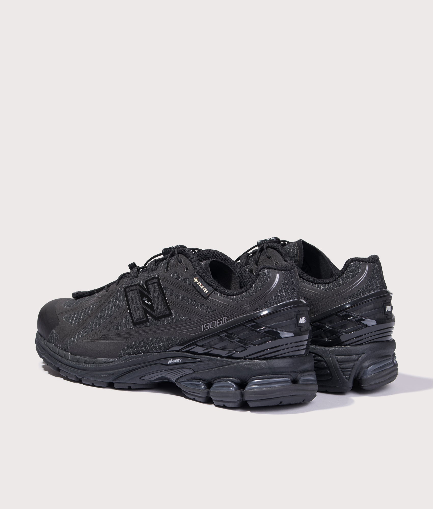 New Balance 1906X Sneakers in Black at EQVVS Menswear. Angled back shot.