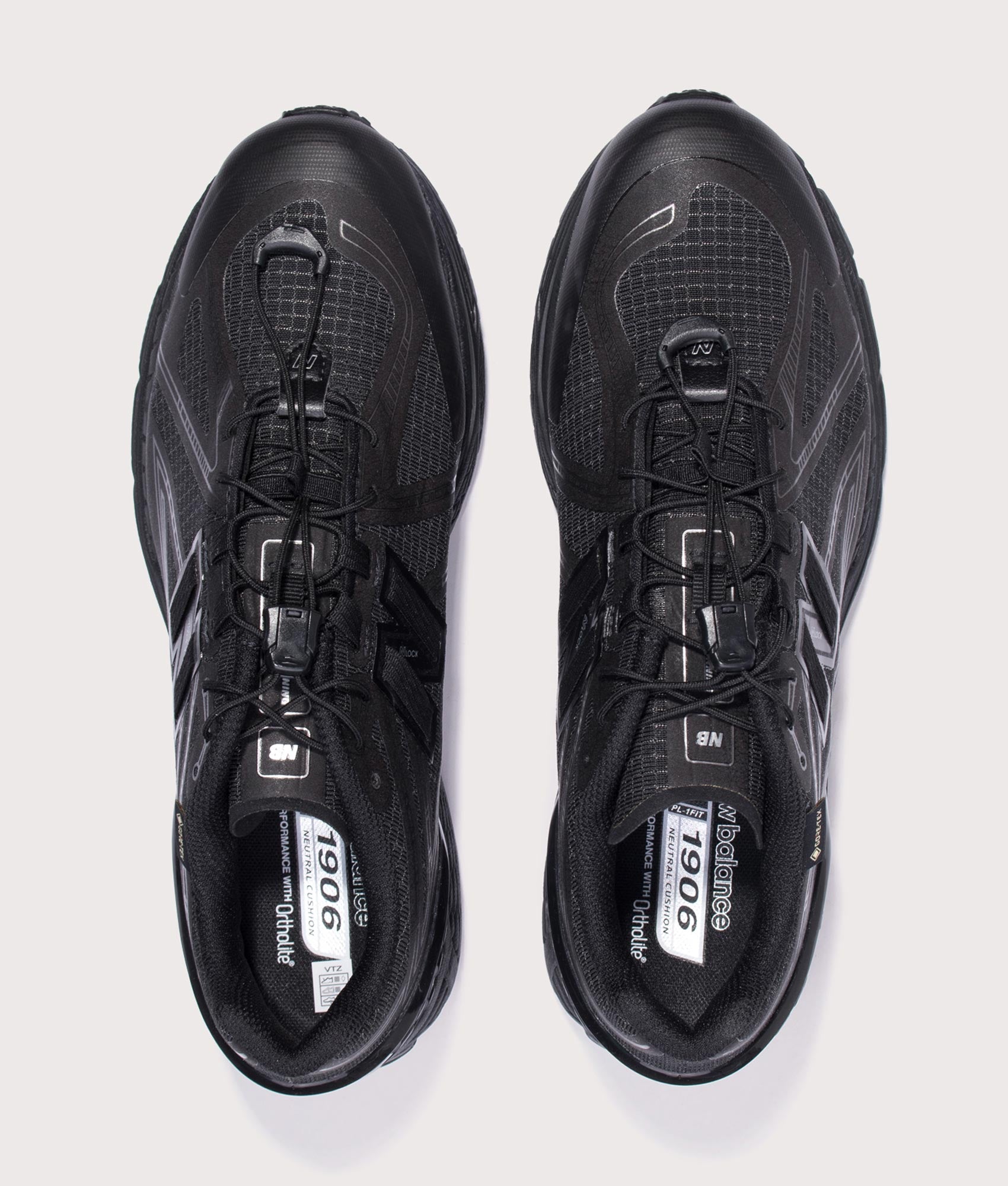 New Balance 1906X Sneakers in Black at EQVVS Menswear. Top shot.