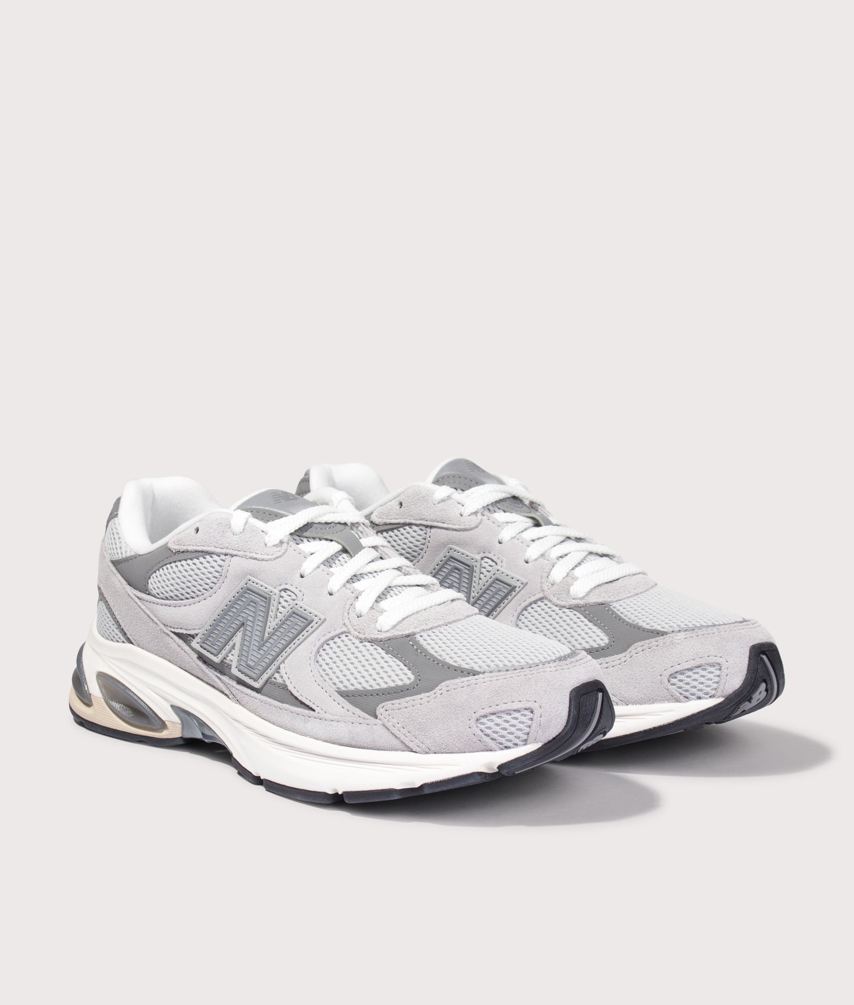 New Balance 2010 Sneakers in Raincloud and Harbor Grey at EQVVS Menswear. Angled front shot.