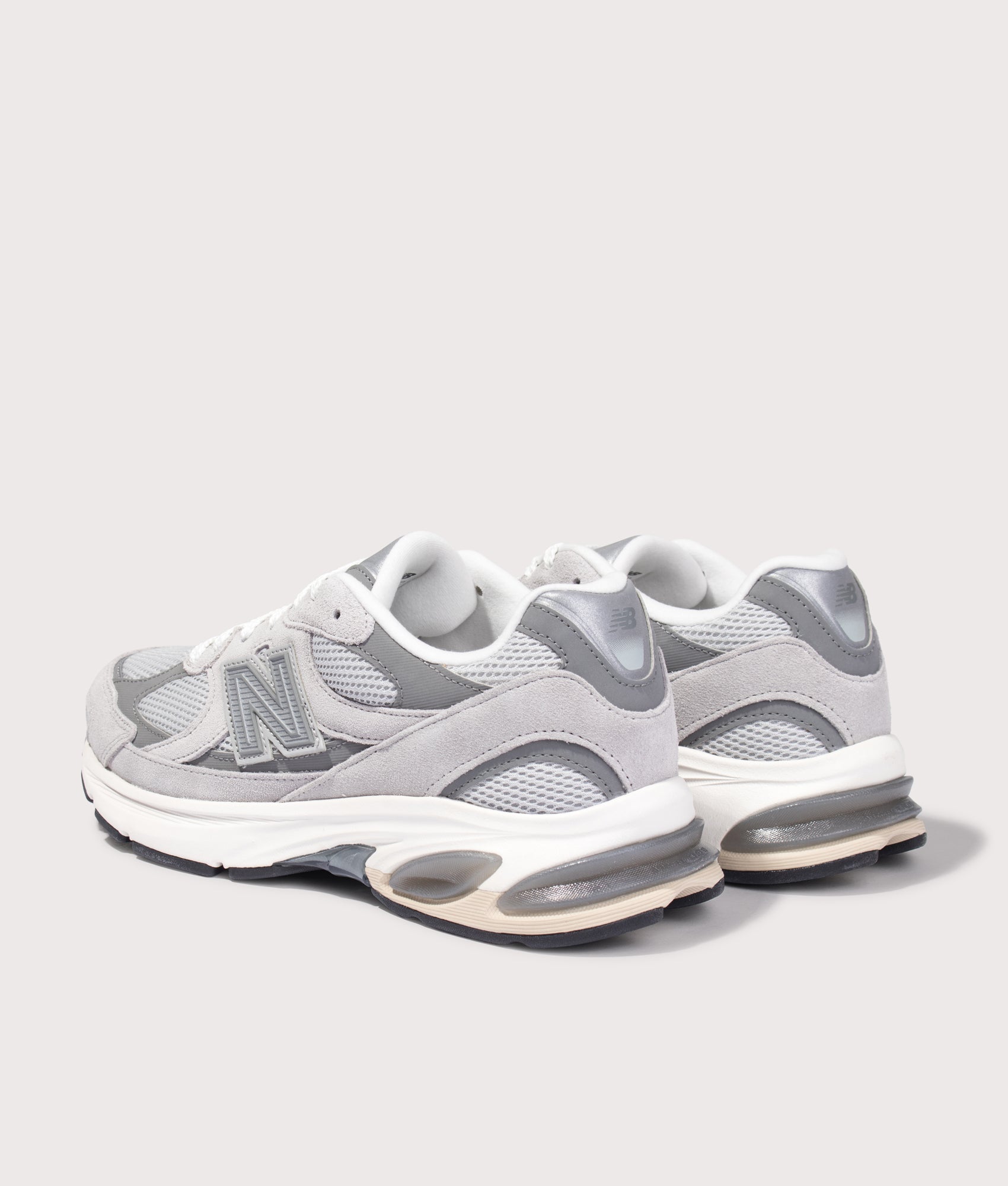 New Balance 2010 Sneakers in Raincloud and Harbor Grey at EQVVS Menswear. Angled back shot.