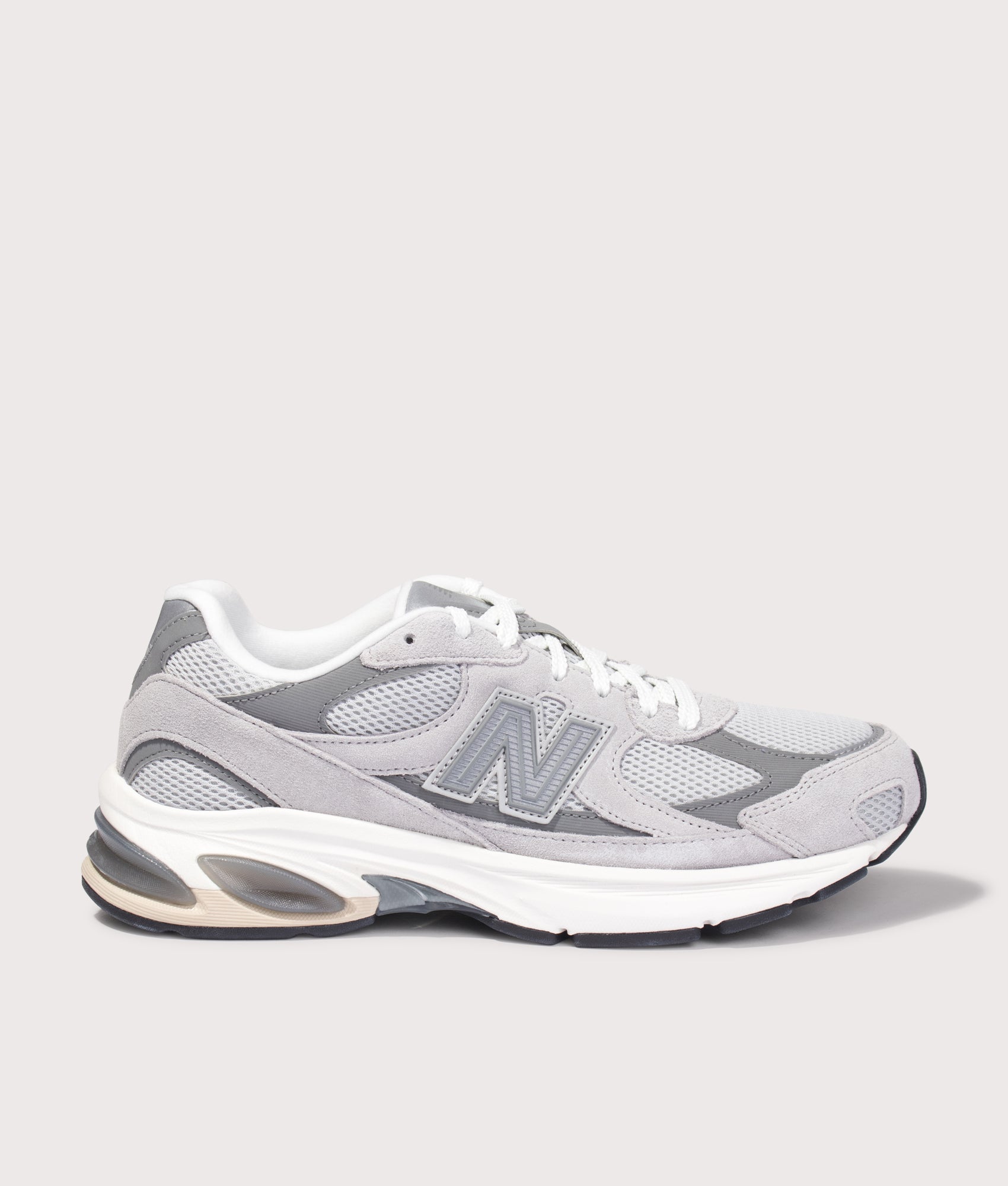 New Balance 2010 Sneakers in Raincloud and Harbor Grey at EQVVS Menswear. Side shot.