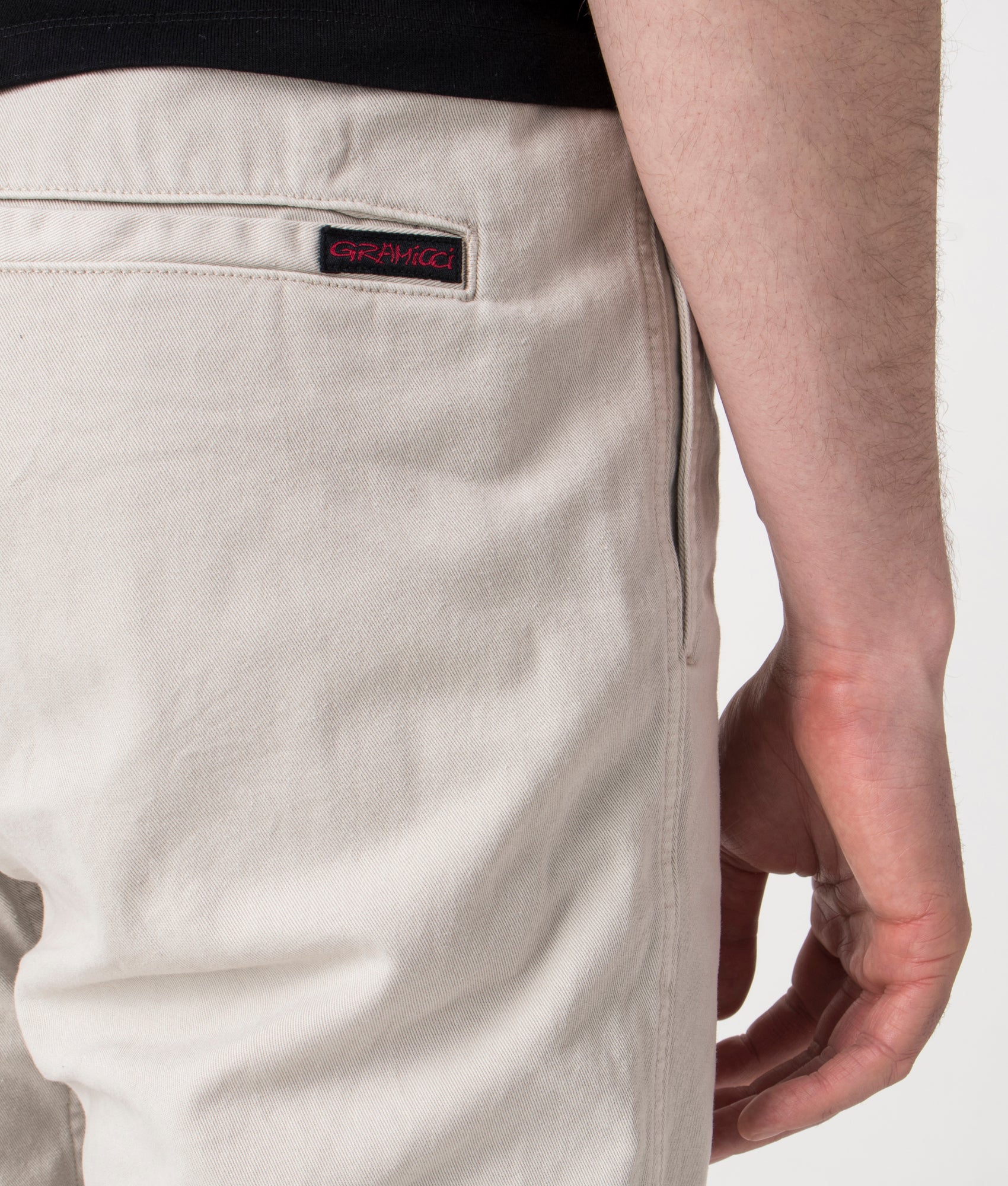 Gramicci Relaxed Fit Gramicci Pants in Dune Pigment at EQVVS. back Detail Shot.