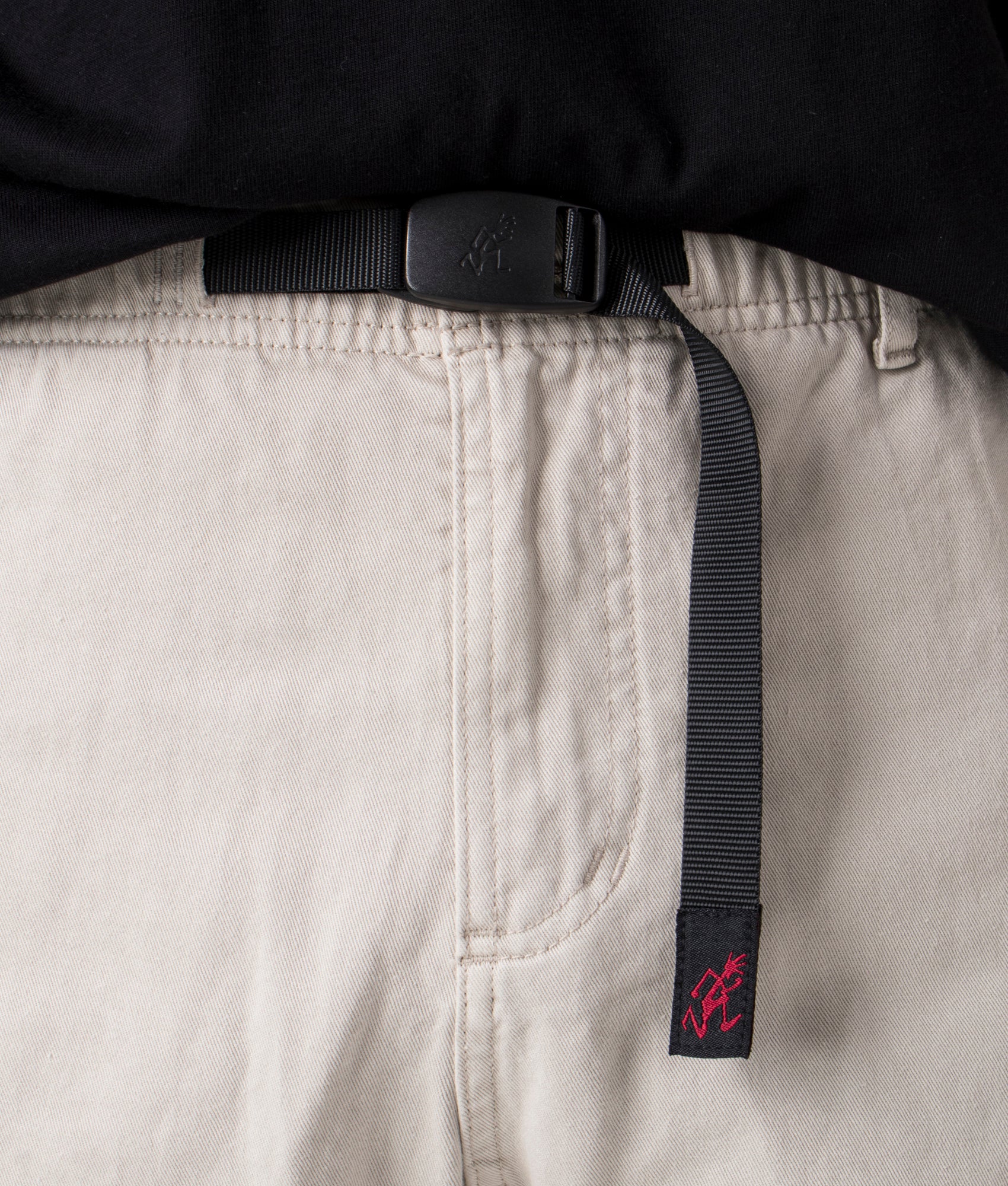 Gramicci Relaxed Fit Gramicci Pants in Dune Pigment at EQVVS. Front Detail Shot.