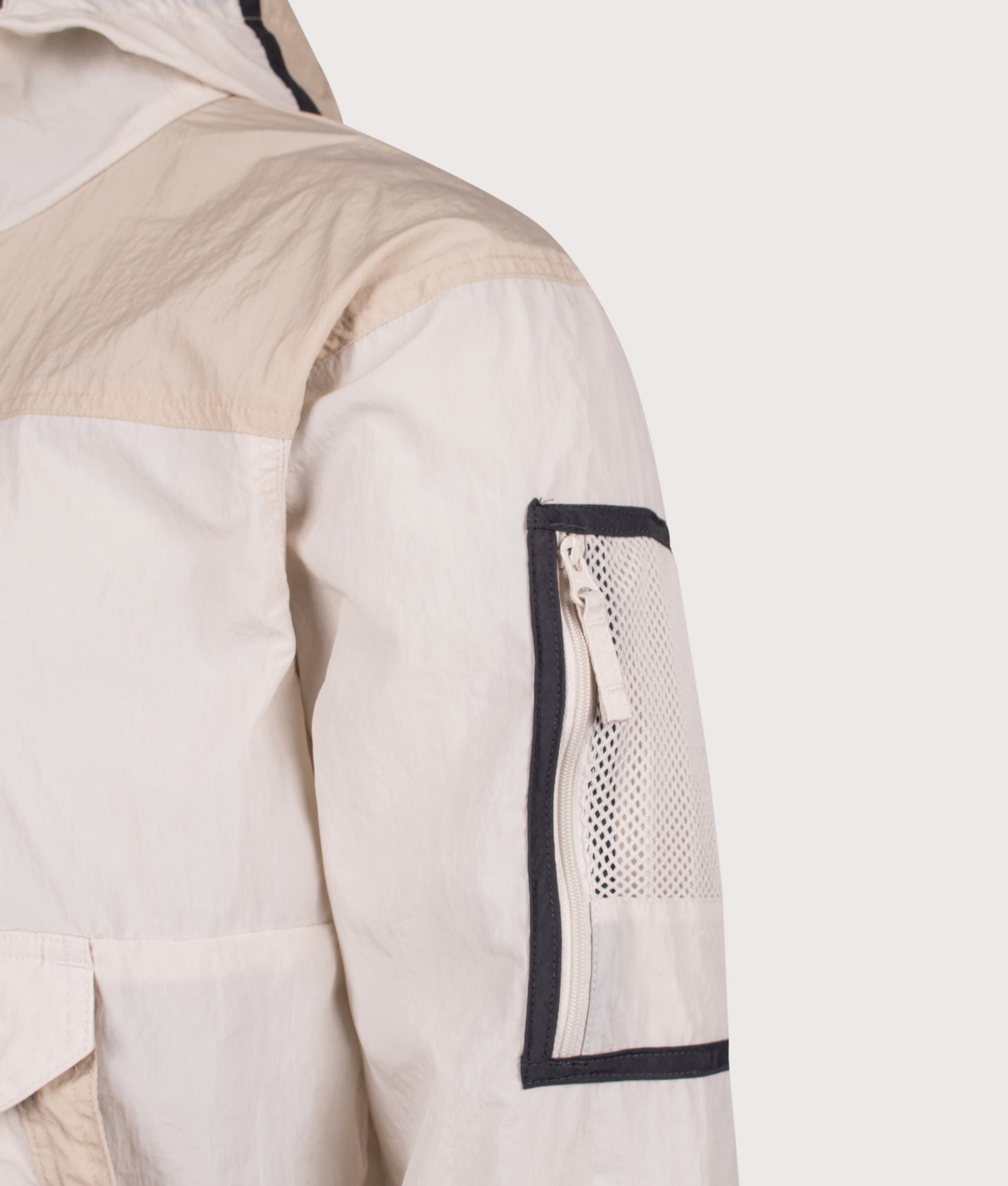 Columbia Challenger Windbreaker Anorak in Dark Stone and Ancient Fossil at EQVVS Menswear. Detail shot.