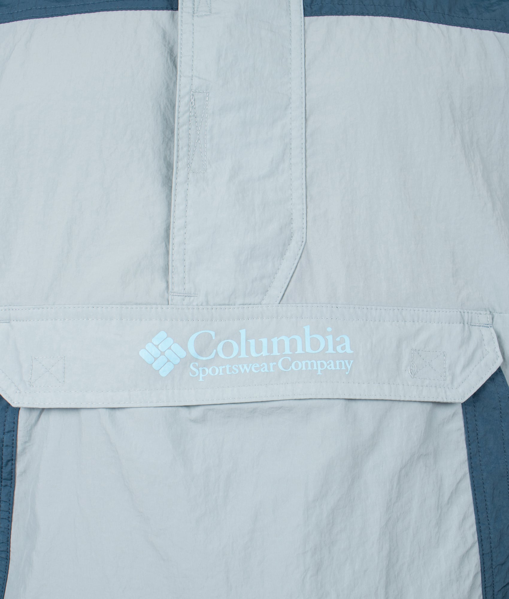Columbia Challenger Windbreaker Anorak in Crushed Blue and Everblue at EQVVS Menswear. Detail shot.