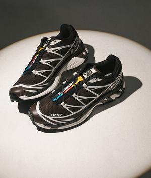 SALOMON XT-6 GTX Sneakers in Black Coffee/French Roast/Vanilla Ice at EQVVS Menswear. Campaign shot.