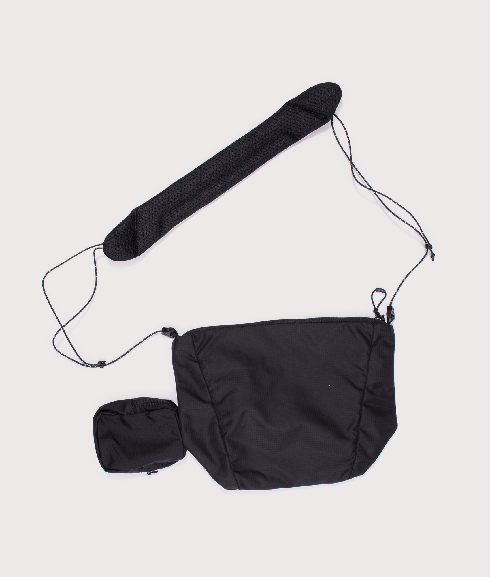 Salomon ACS 2 REVISED Crossbody Bag in Black at EQVVS Menswear. Back shot.