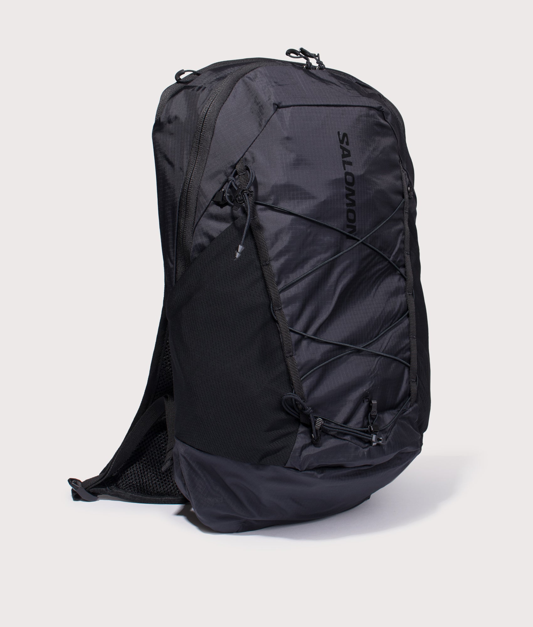 Salomon XT 15 Backpack in black at EQVVS Menswear. Angled front shot.