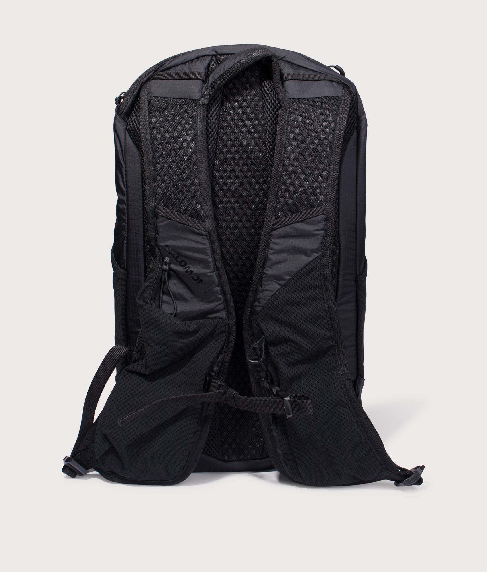 Salomon XT 15 Backpack in black at EQVVS Menswear. Back shot.