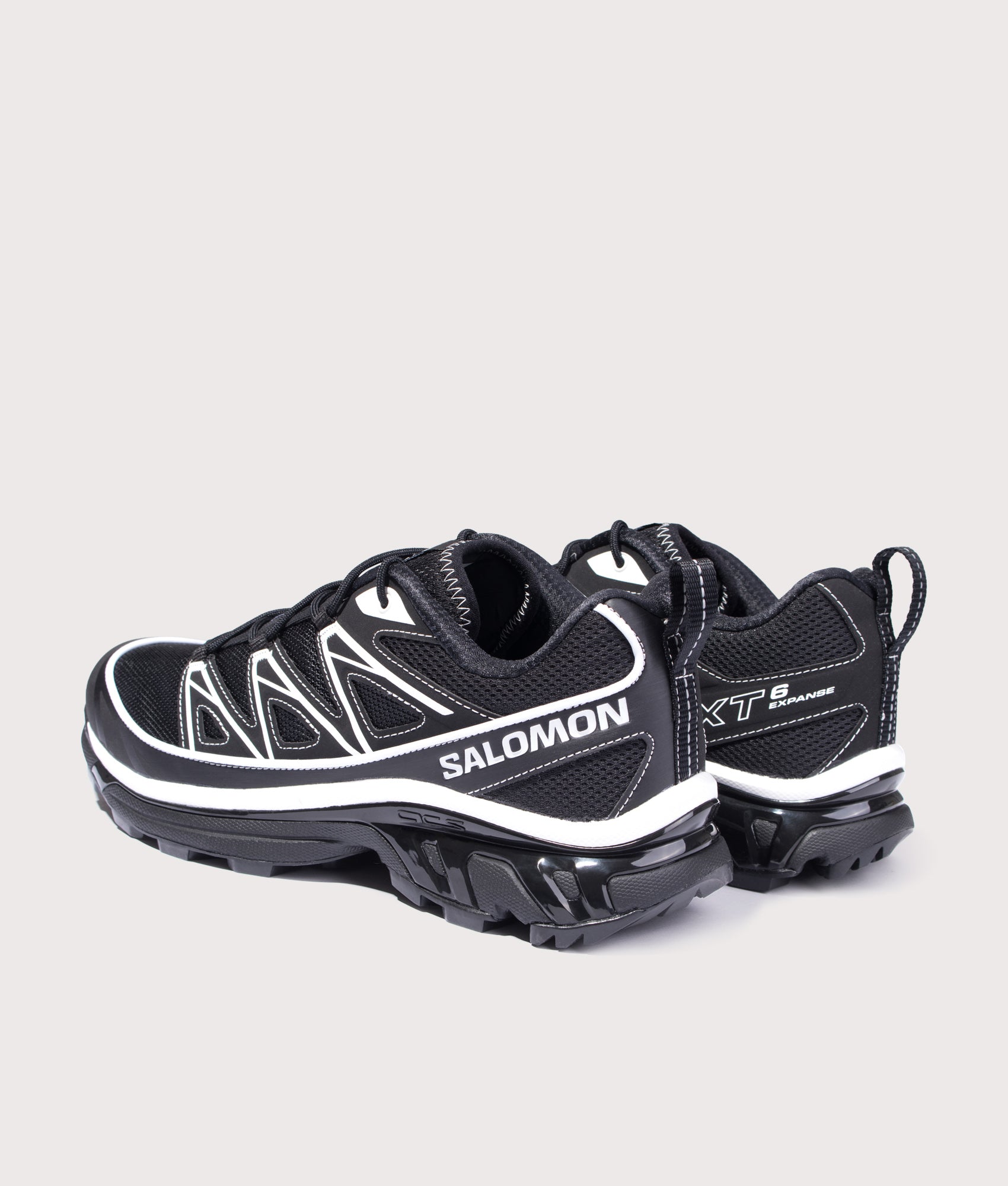 SALOMON XT-6 EXPANSE Sneakers in Black, Black and White at EQVVS Menswear. Angled back shot.
