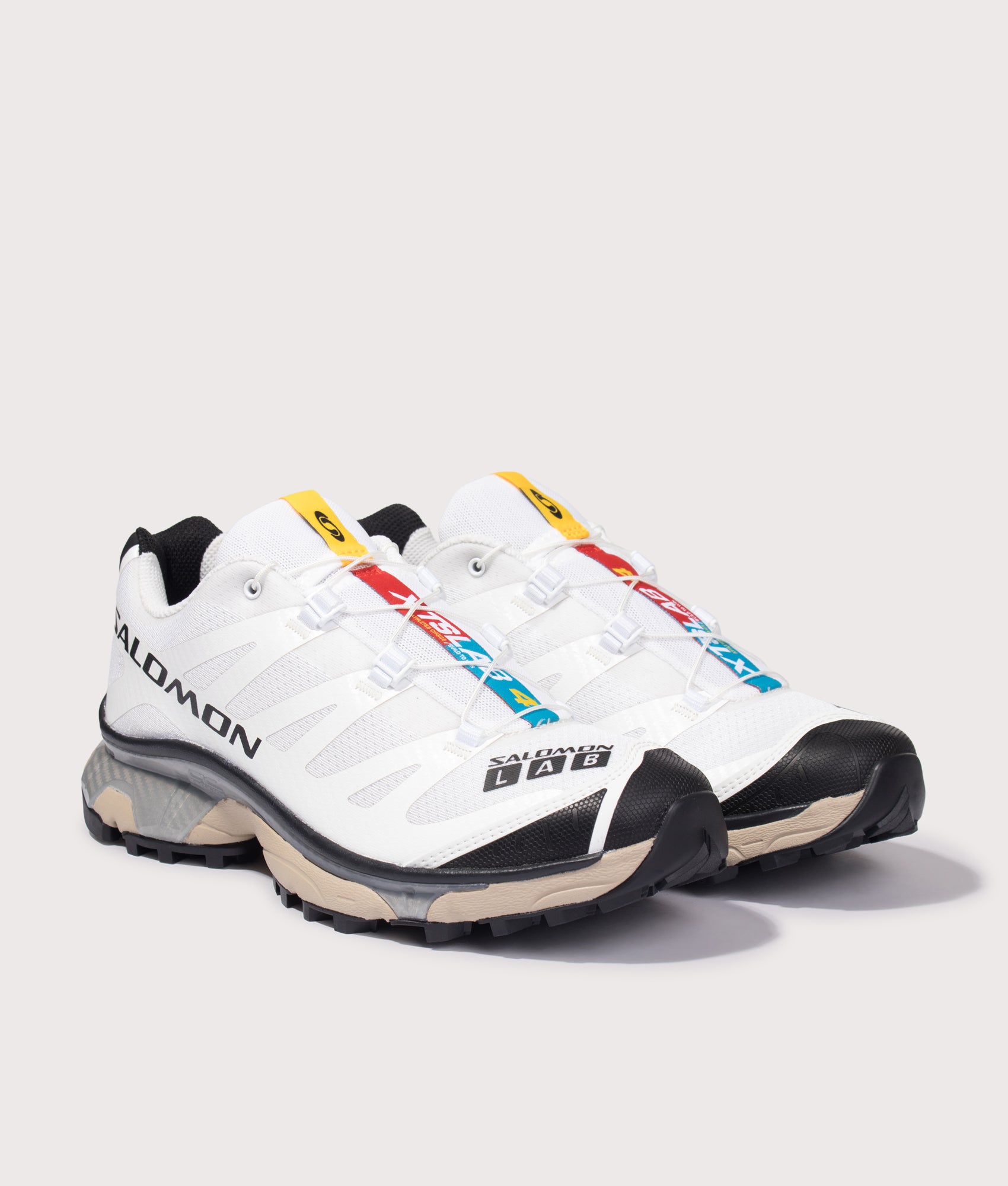 Salomon XT-4 OG in White/Black/White Pepper at EQVVS Menswear. Angled front shot.