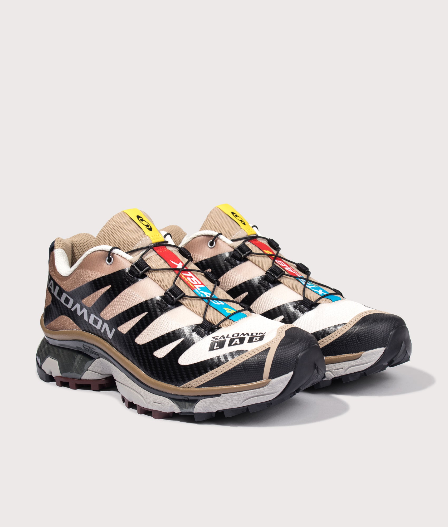 Salomon XT-4 OG in Black, Desert Tan and Vanila at EQVVS Menswear. Angled front shot.