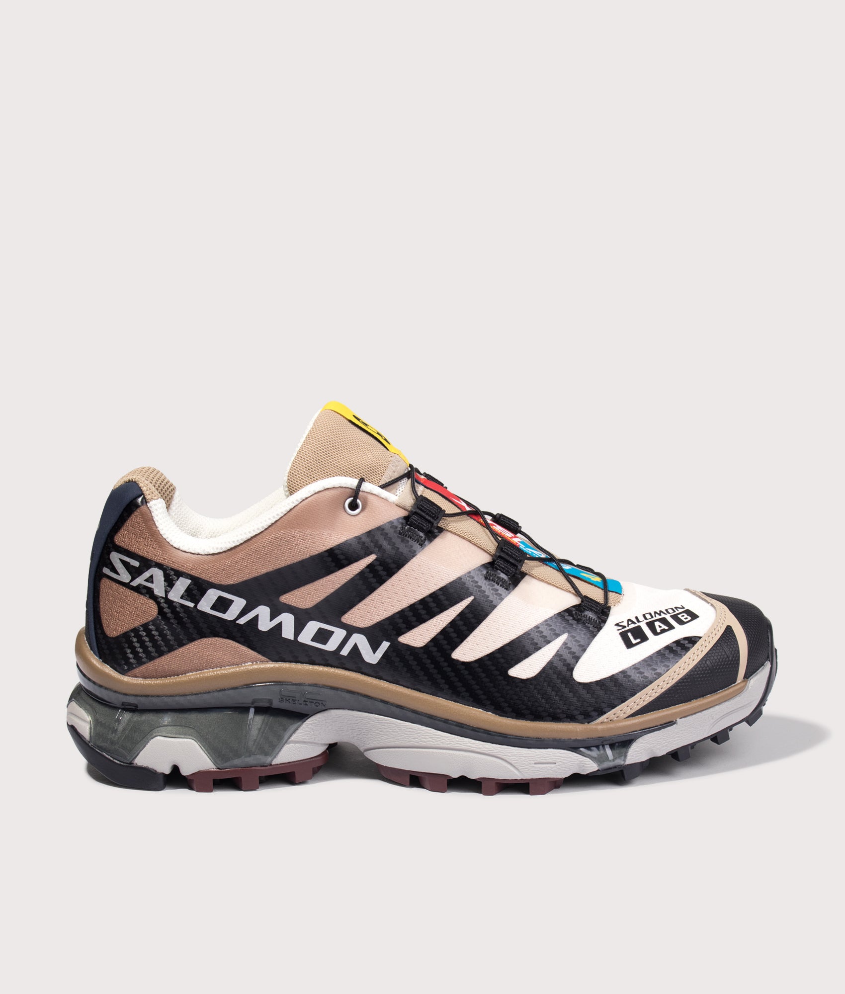 Salomon XT-4 OG in Black, Desert Tan and Vanila at EQVVS Menswear. Side detail shot.