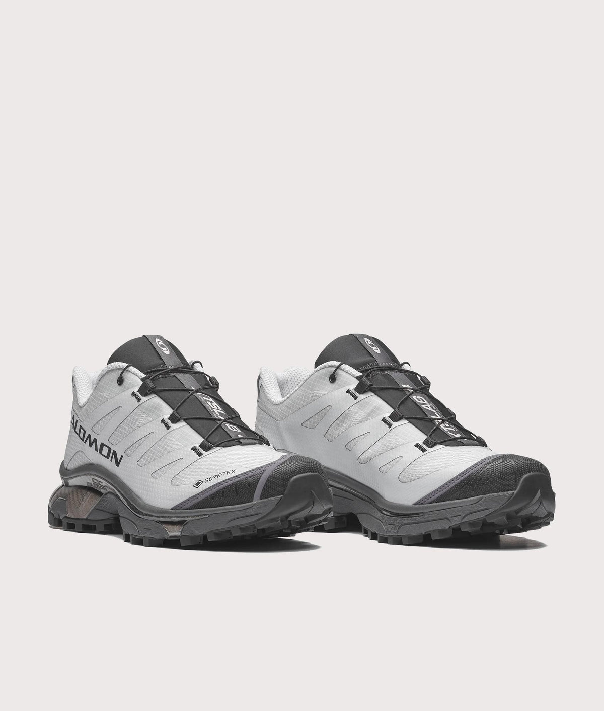 SALOMON XT-4 OG GTX Sneakers in Pearl blue, Asphalt and Black at EQVVS Menswear. Angled front shot.