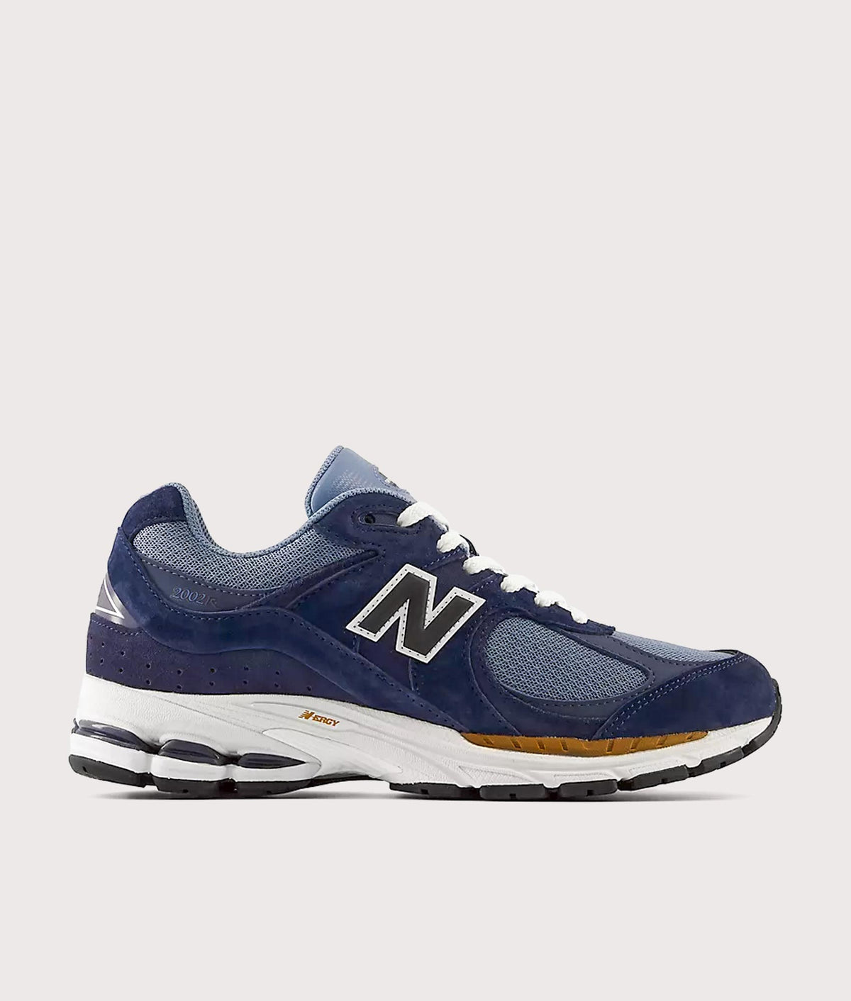 New Balance 2002R Sneakers in Navy and Vintage Indigo at EQVVS Menswear. Side shot.