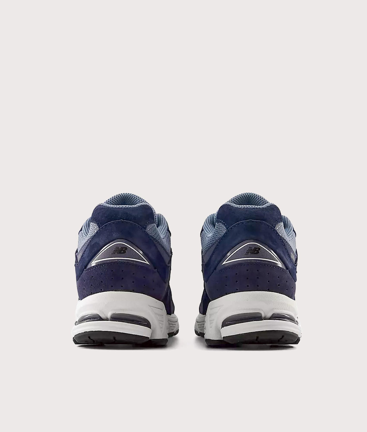 New Balance 2002R Sneakers in Navy and Vintage Indigo at EQVVS Menswear. Back shot.