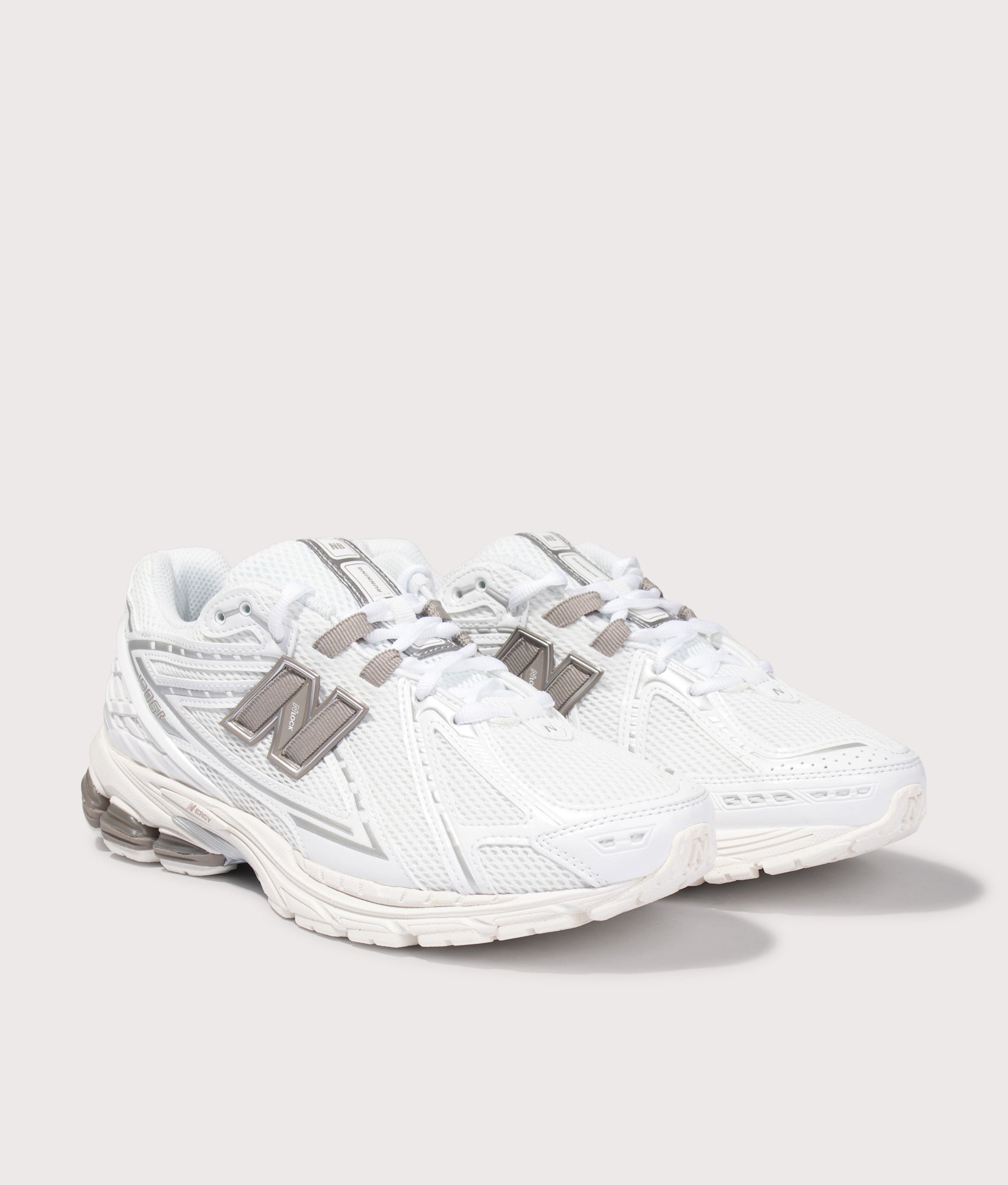 New Balance 1906 Sneakers in White at EQVVS Menswear. Angled front shot.