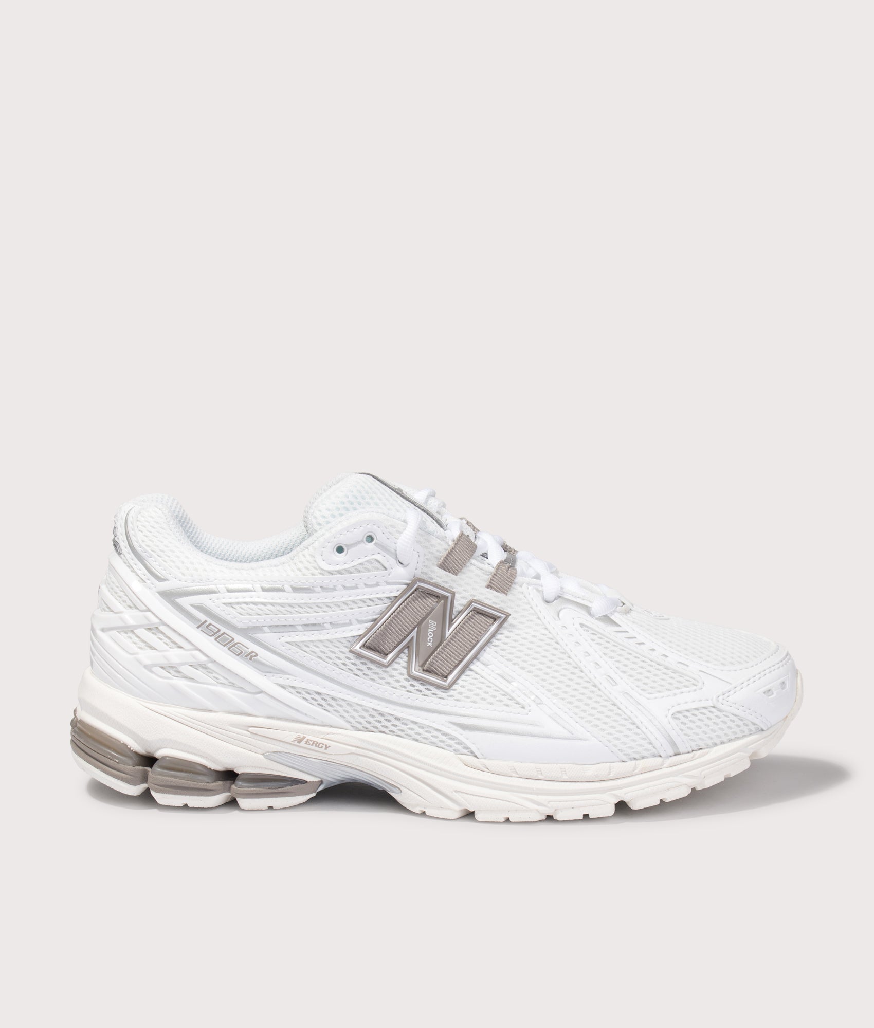 New Balance 1906 Sneakers in White at EQVVS Menswear. Side shot.