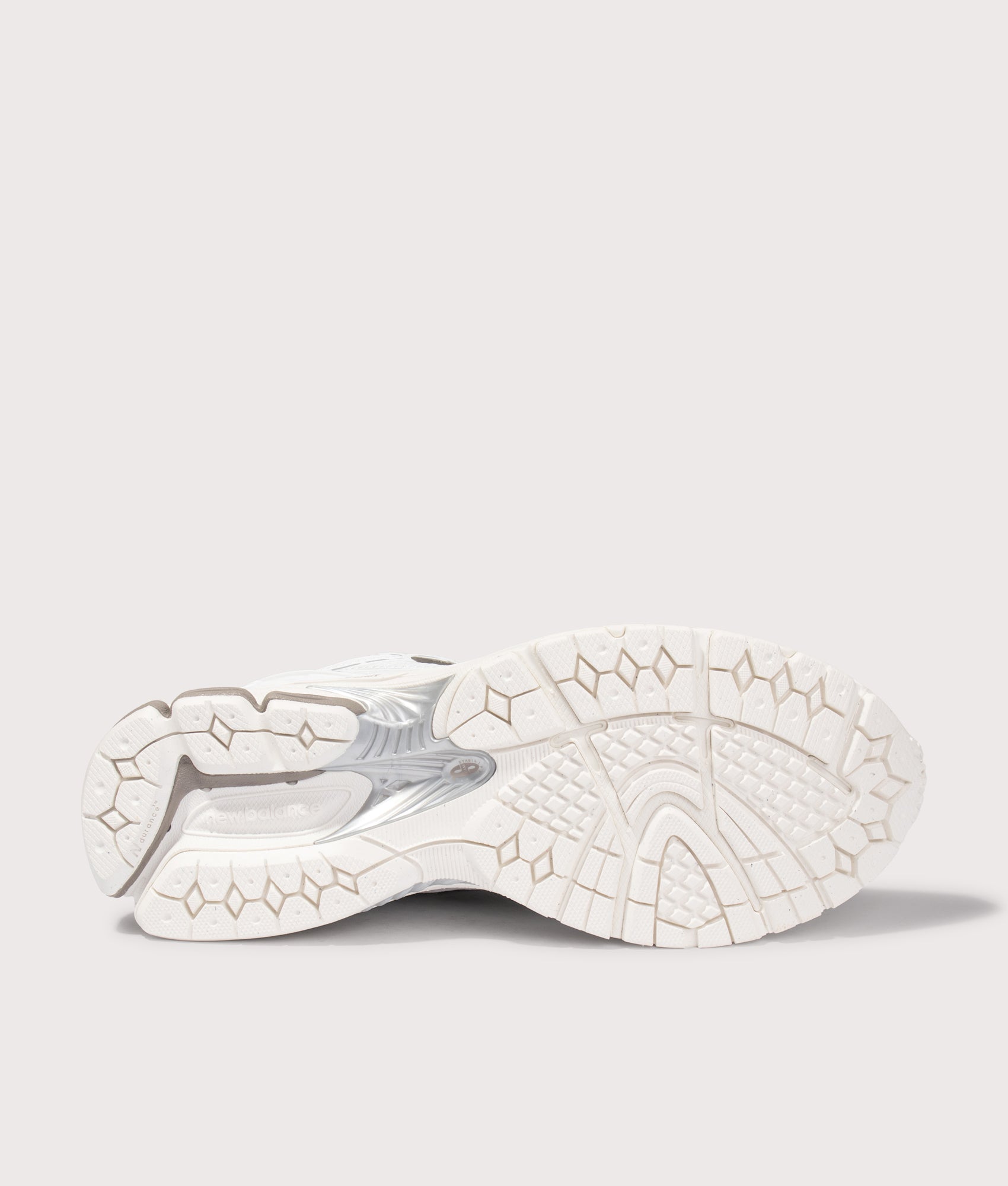New Balance 1906 Sneakers in White at EQVVS Menswear. Tread shot.