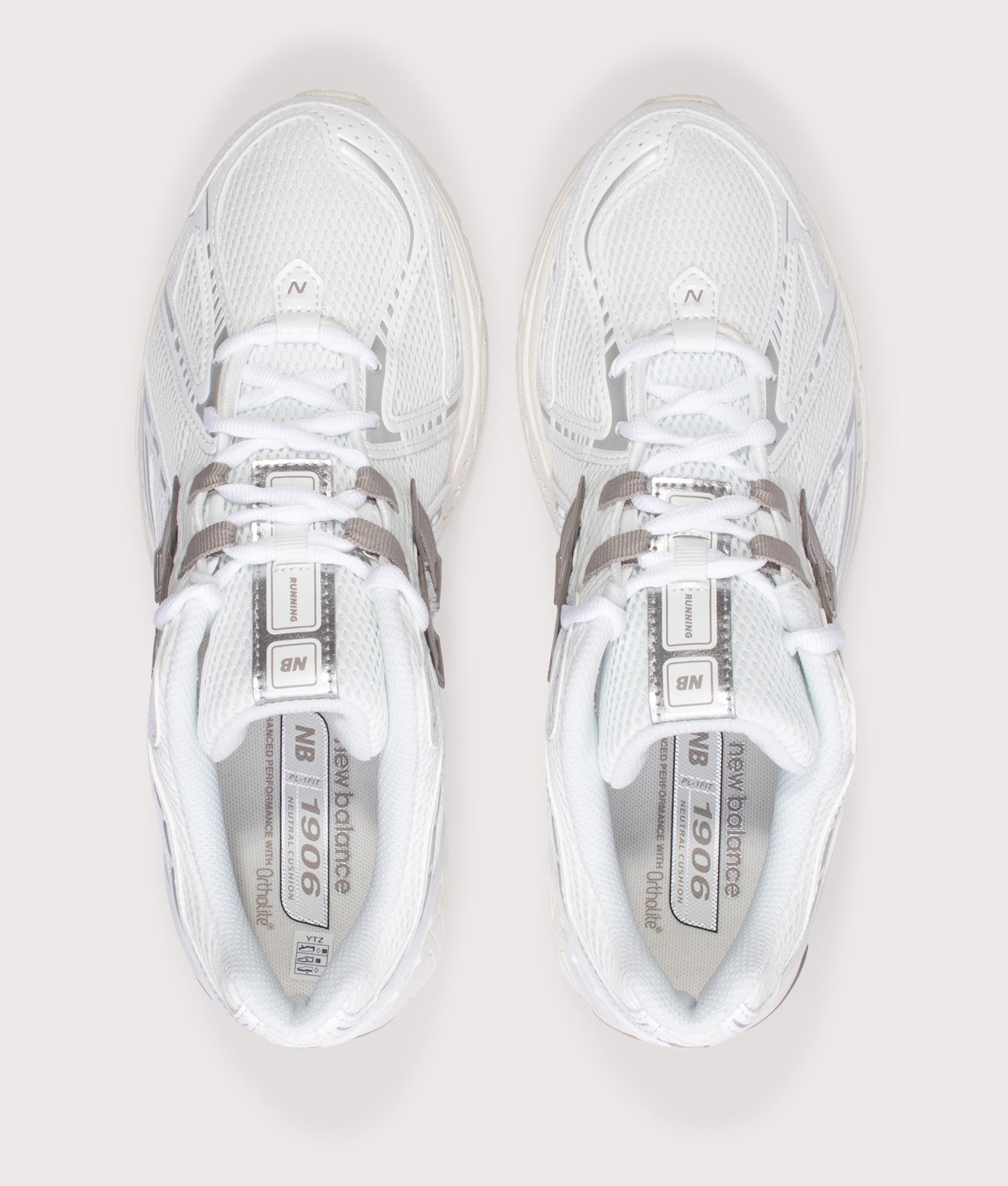 New Balance 1906 Sneakers in White at EQVVS Menswear. Top shot.
