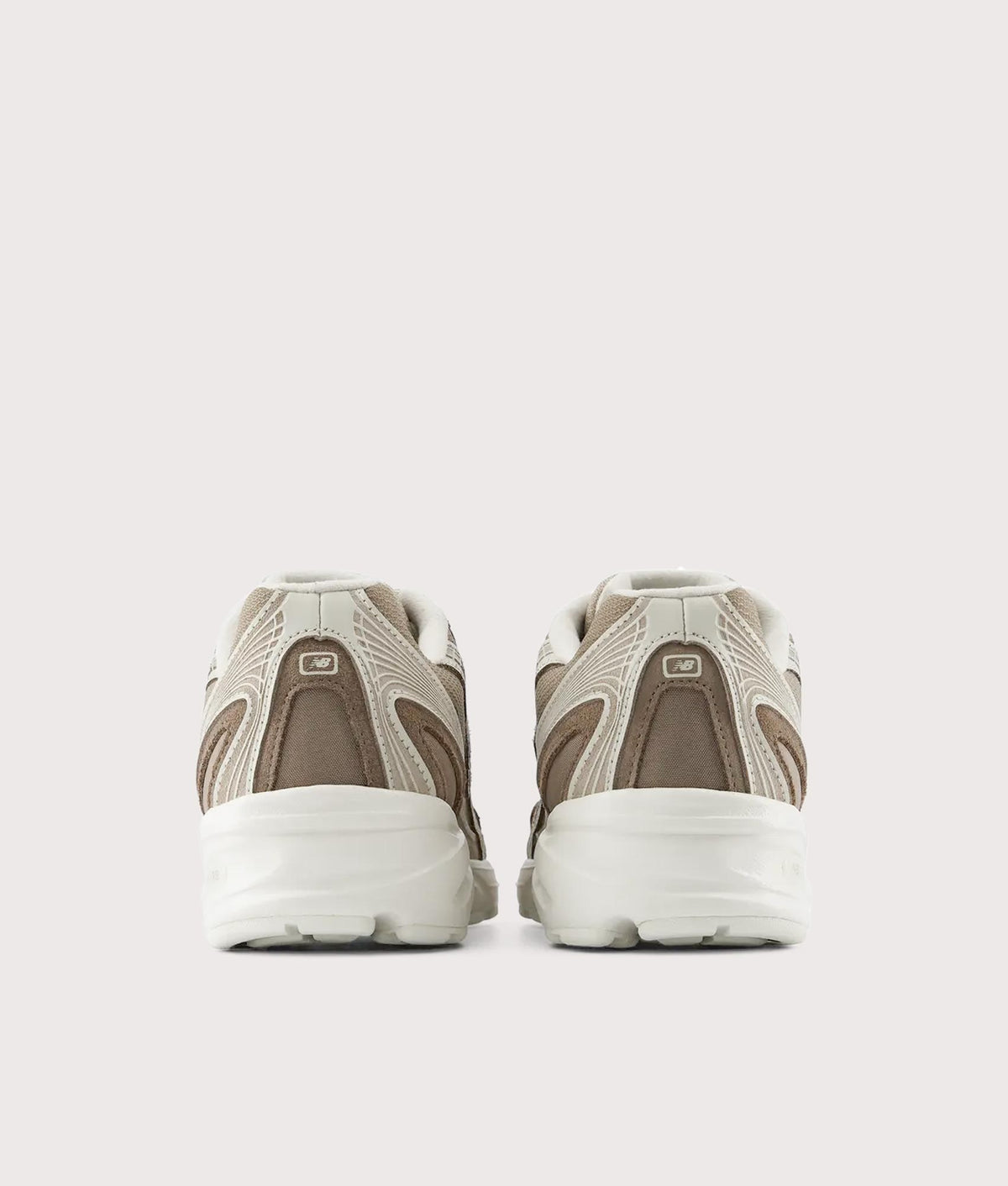 New Balance 740 Sneakers in Mushroom and Driftwood at EQVVS Menswear. Back shot.