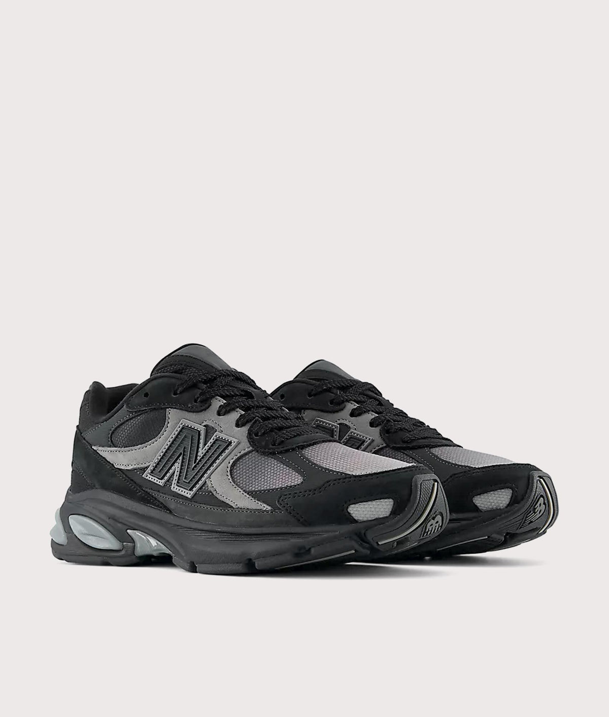 New Balance 2010 Sneakers in Black and Harbor Grey at EQVVS Menswear. Angled front shot.