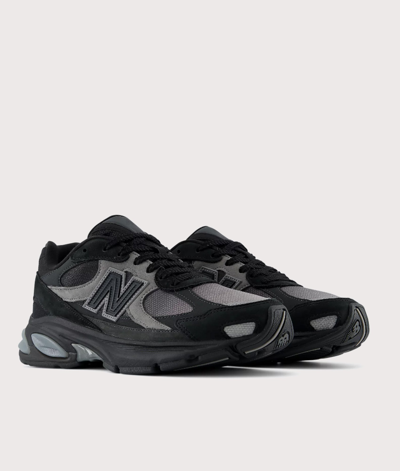 New Balance 2010 Sneakers in Black and Harbor Grey at EQVVS Menswear. Angled front shot.