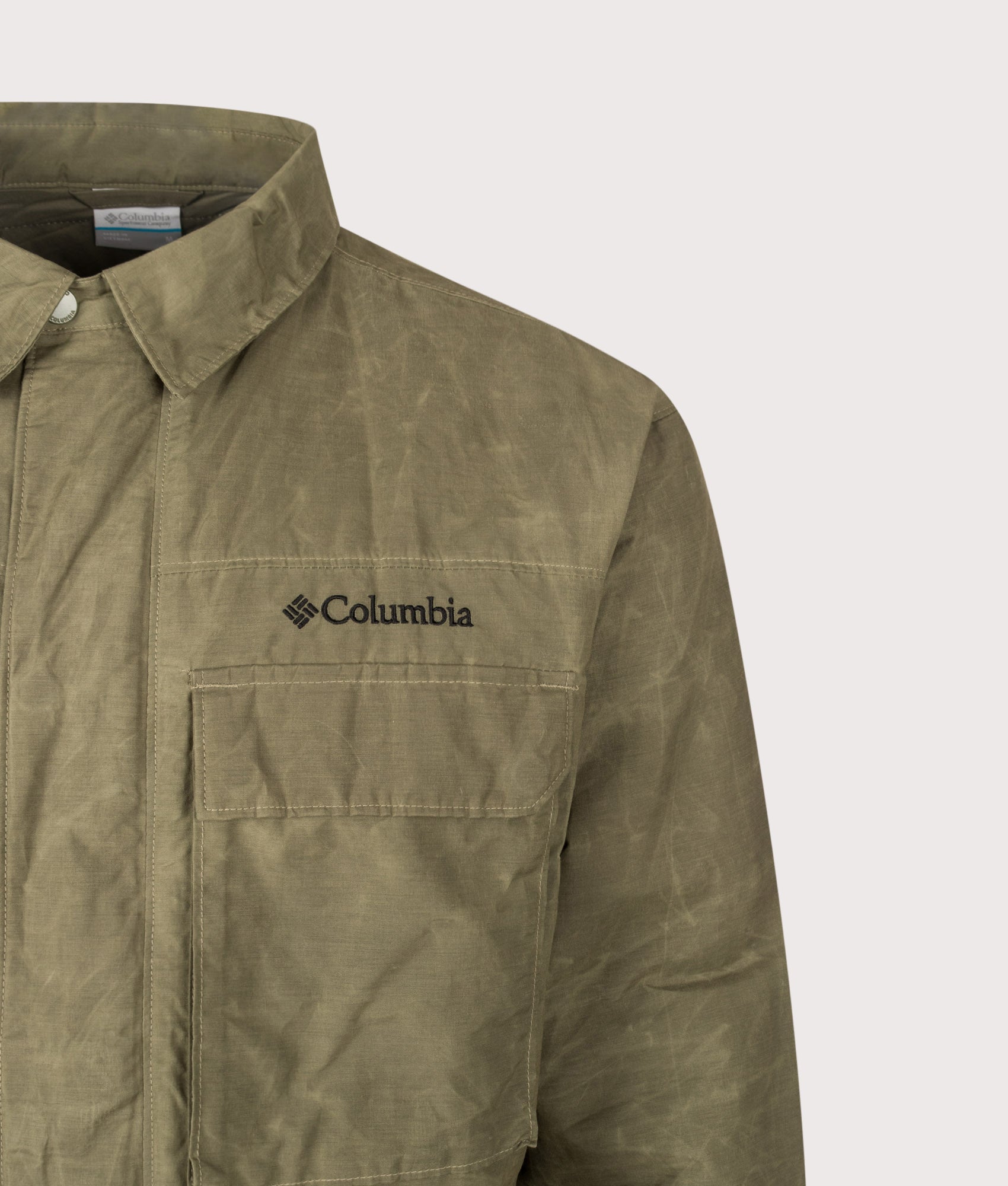 Columbia Timberline Tough Jacket in Stone Green at EQVVS Menswear. Detail shot.