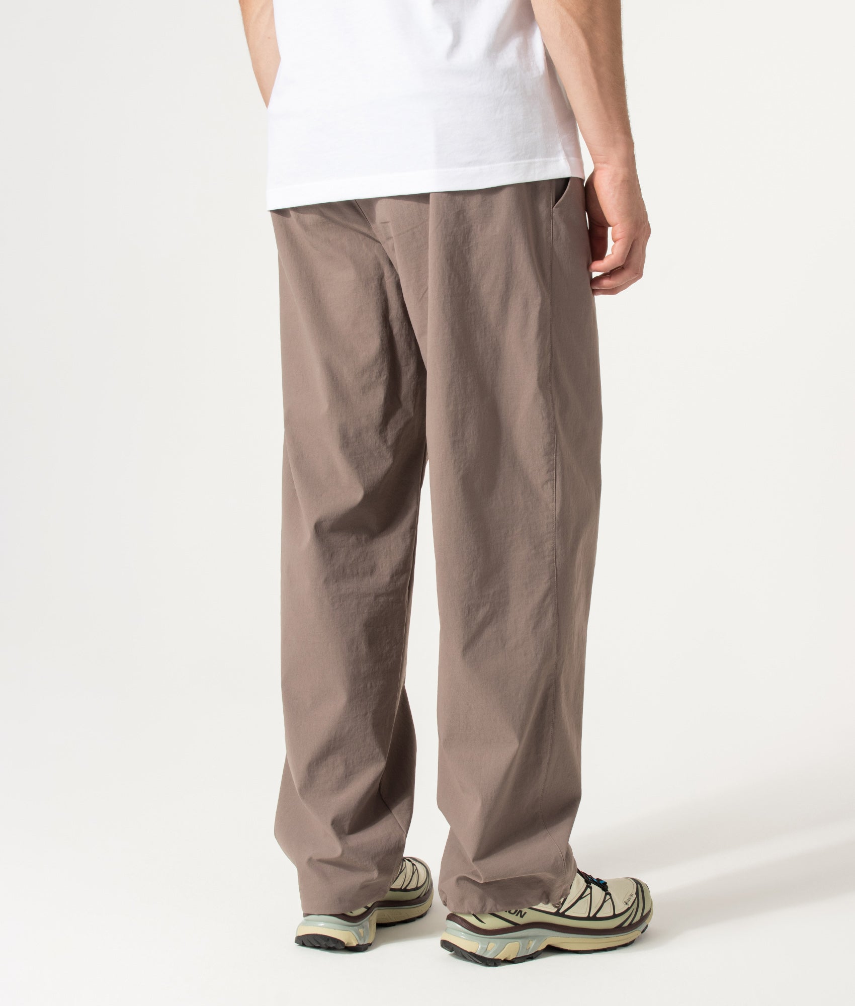 Columbia Relaxed Fit Grave Creek™ Tech Chinos in Iron at EQVVS Menswear. Angled model back shot.