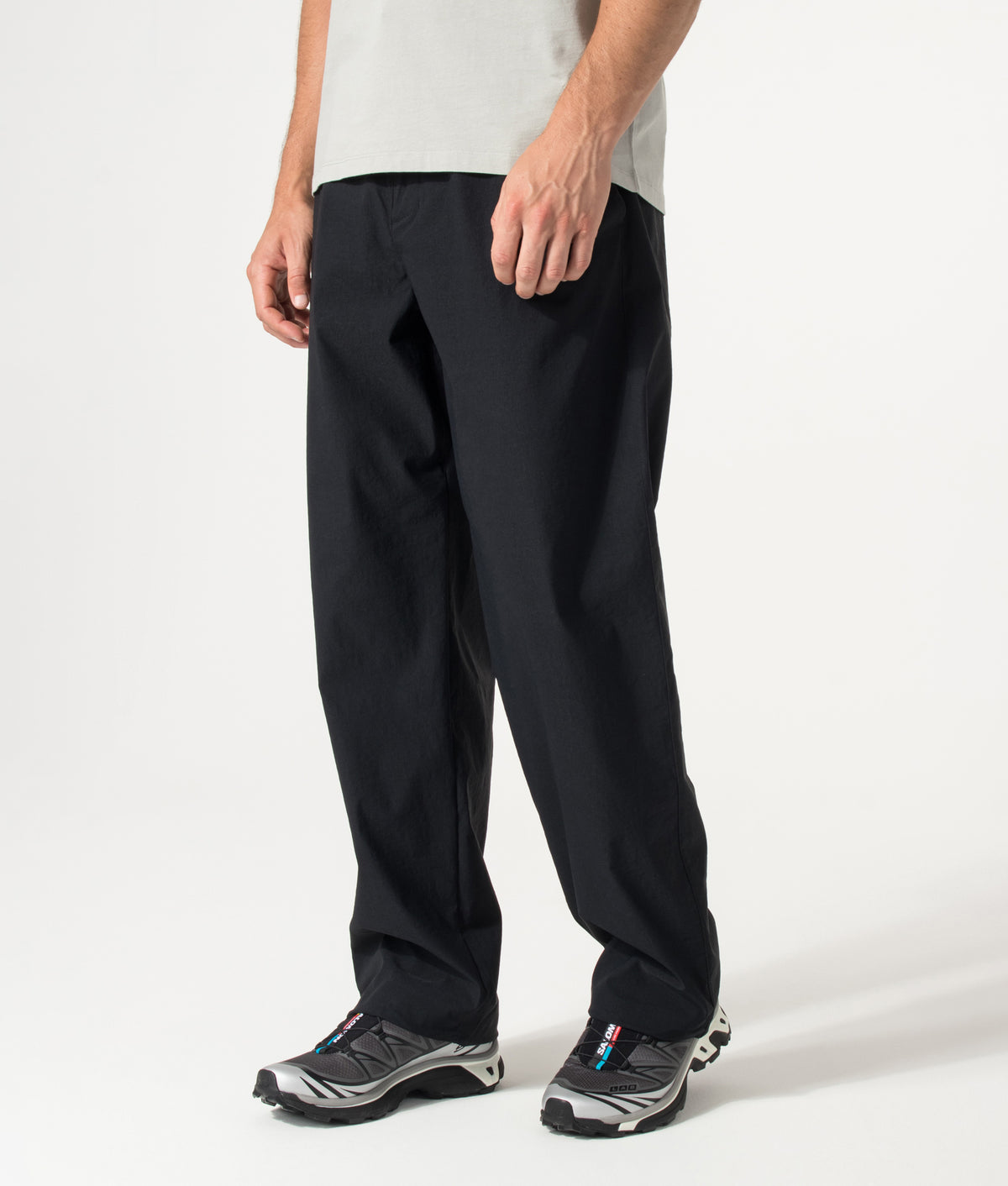 Columbia Relaxed Fit Grave Creek™ Tech Chinos in Black at EQVVS Menswear. Angled model front shot.