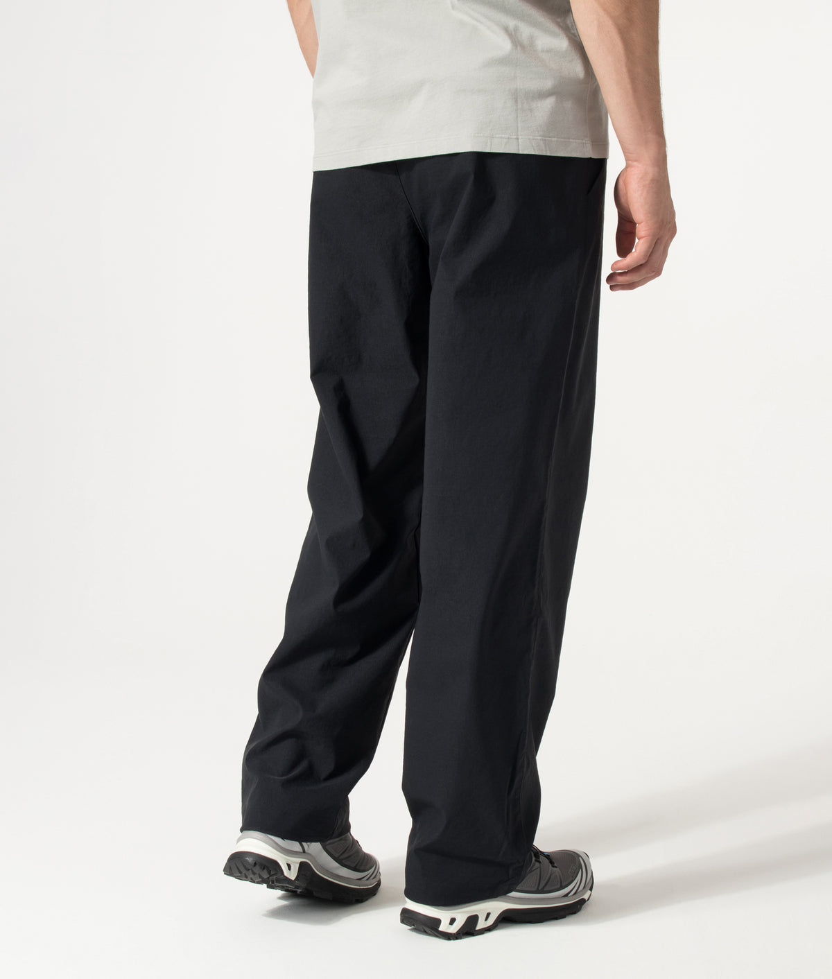 Columbia Relaxed Fit Grave Creek™ Tech Chinos in Black at EQVVS Menswear. Model angled back shot.