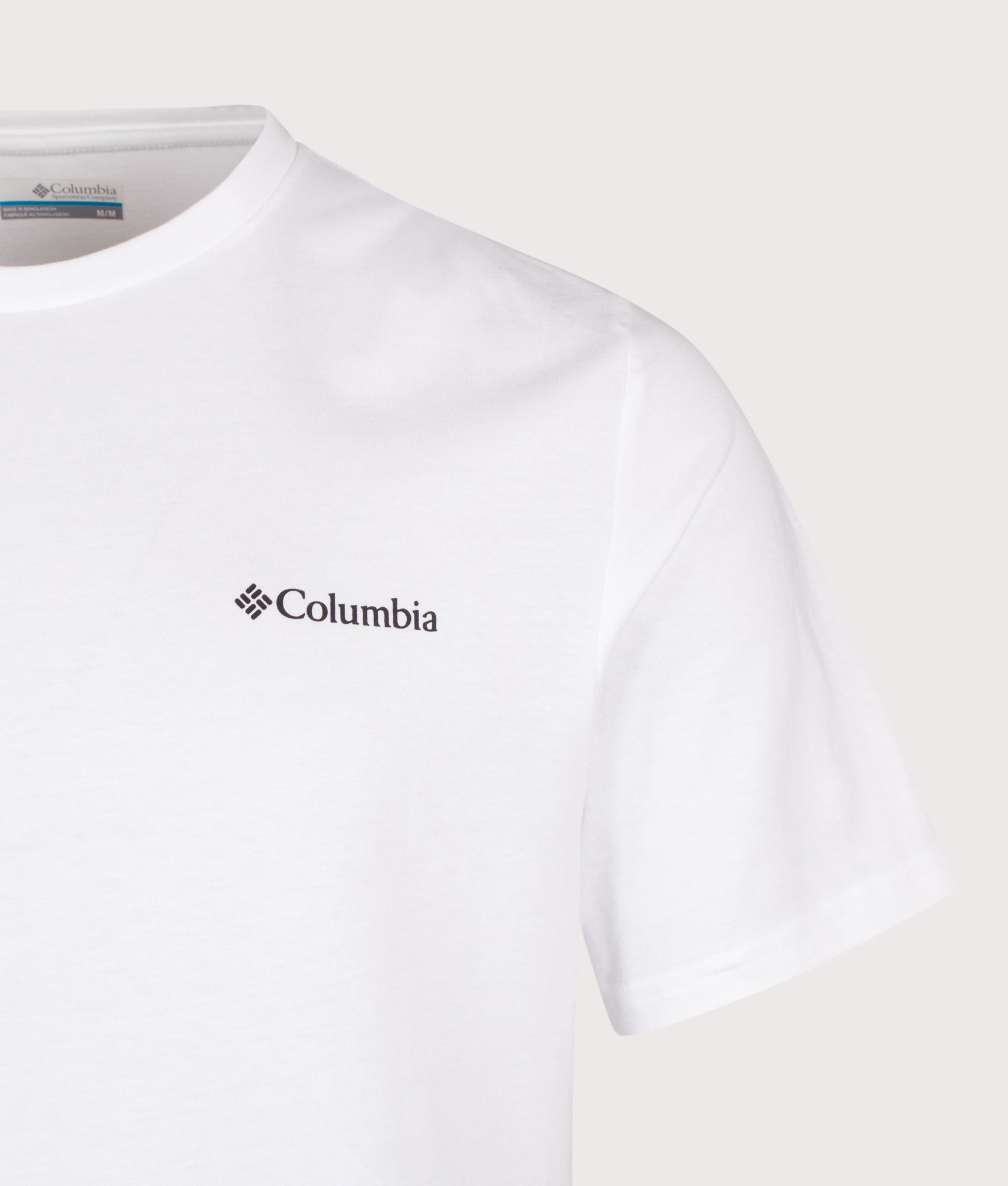 Columbia Regular Fit CSC Outdoor Back Graphic T-Shirt in White/Flower Power Badge at EQVVS Menswear. Detail shot.