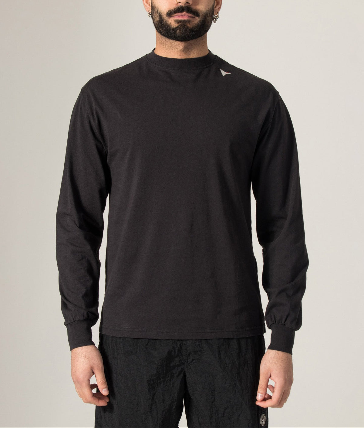 ROA Logo Long Sleeve T-Shirt in Washed Black at EQVVS Menswear. Model shot.