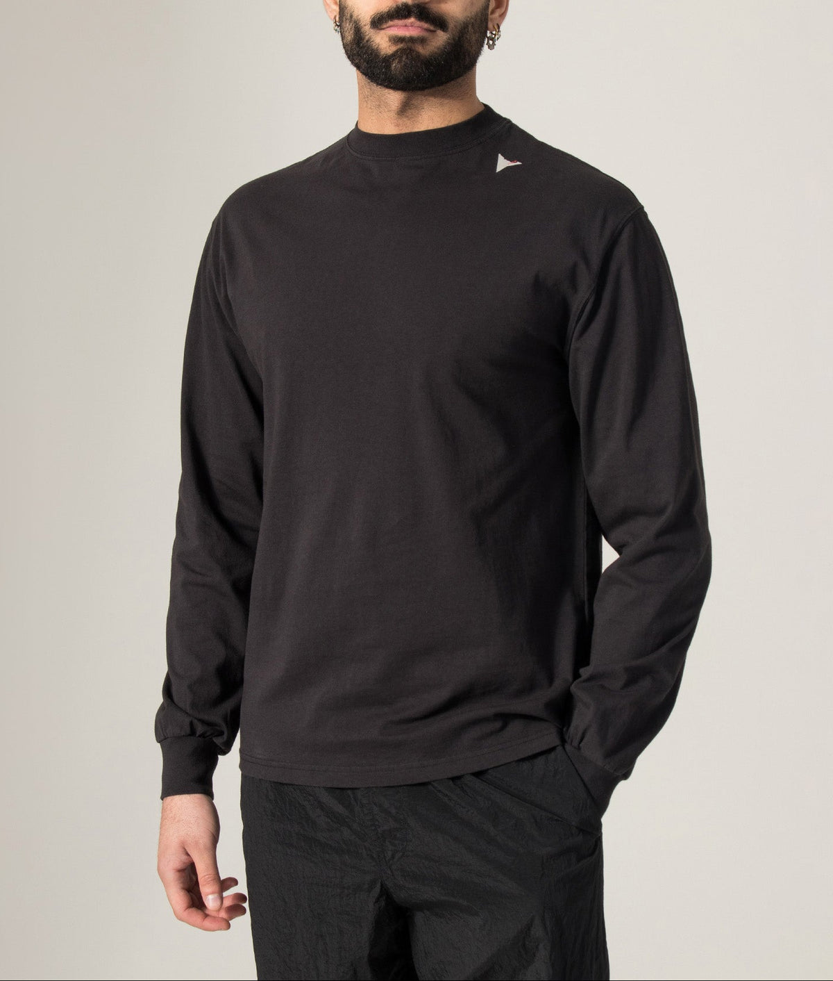 ROA Logo Long Sleeve T-Shirt in Washed Black at EQVVS Menswear. Model shot.