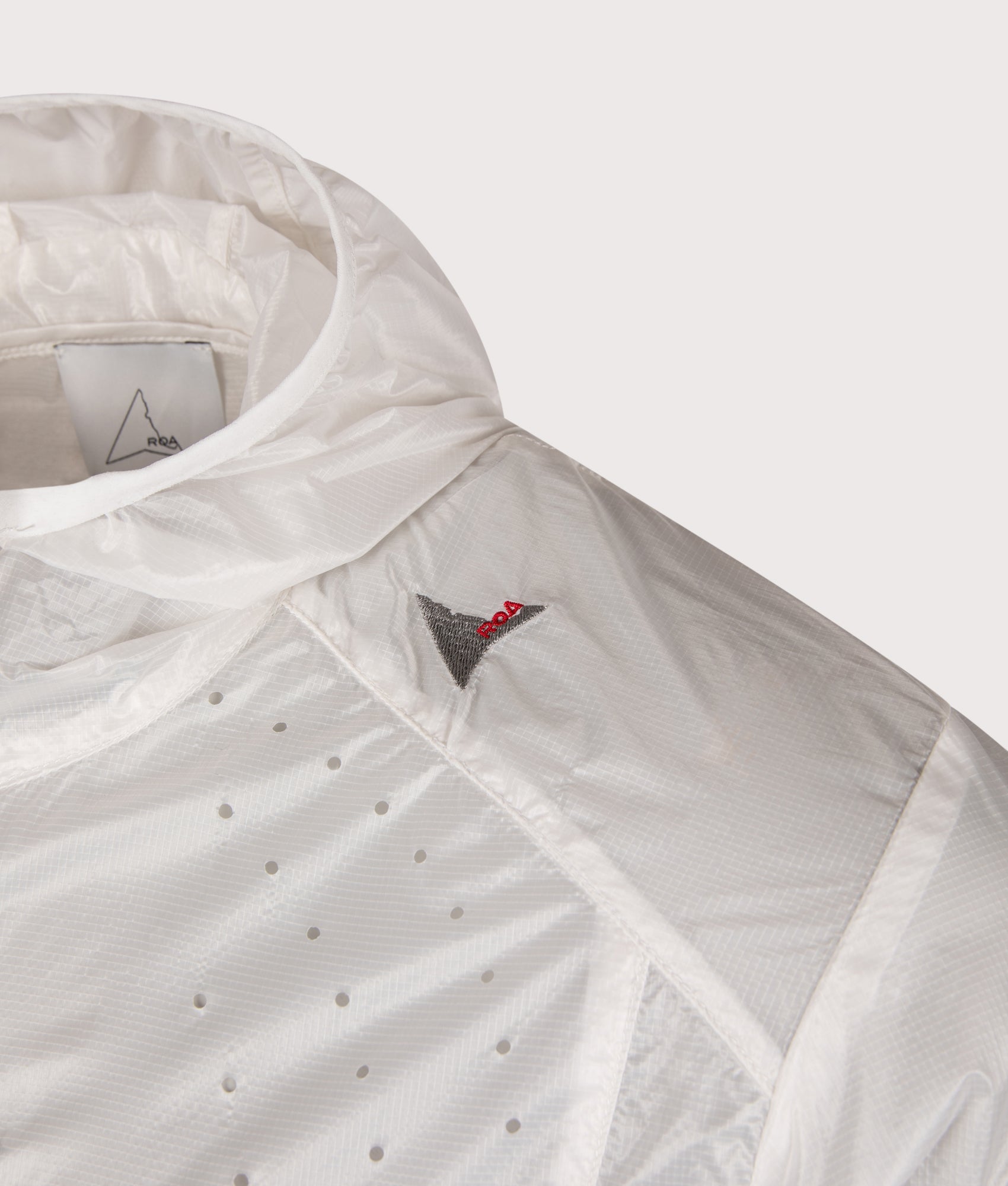 ROA Hue Packable Lightweight Windcheater in White at EQVVS Menswear. Detail shot.