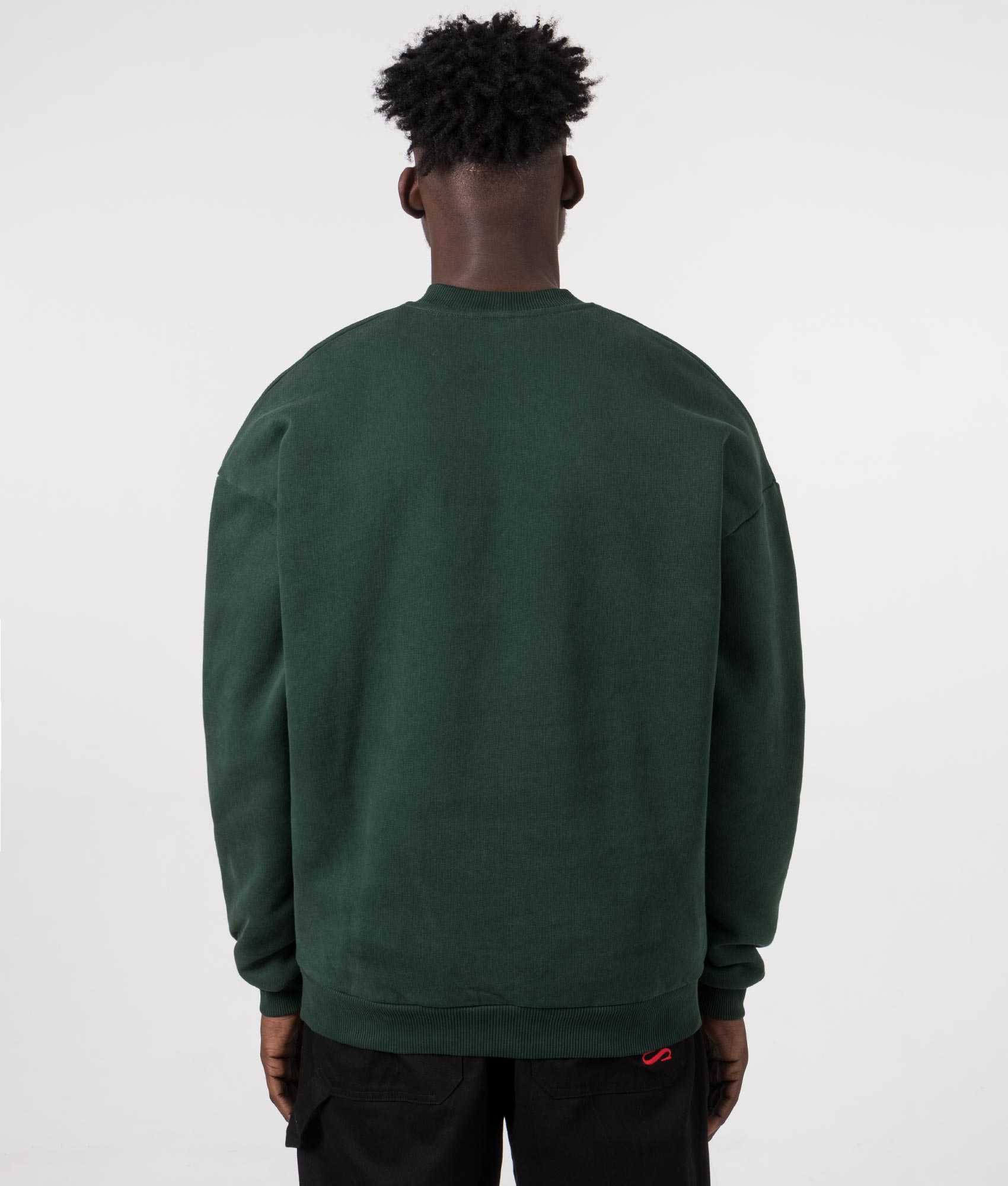 MKI MIYUKI ZOKU Oversized Uniform Crewneck Sweatshirt in Green at EQVVS Menswear. Model back shot.