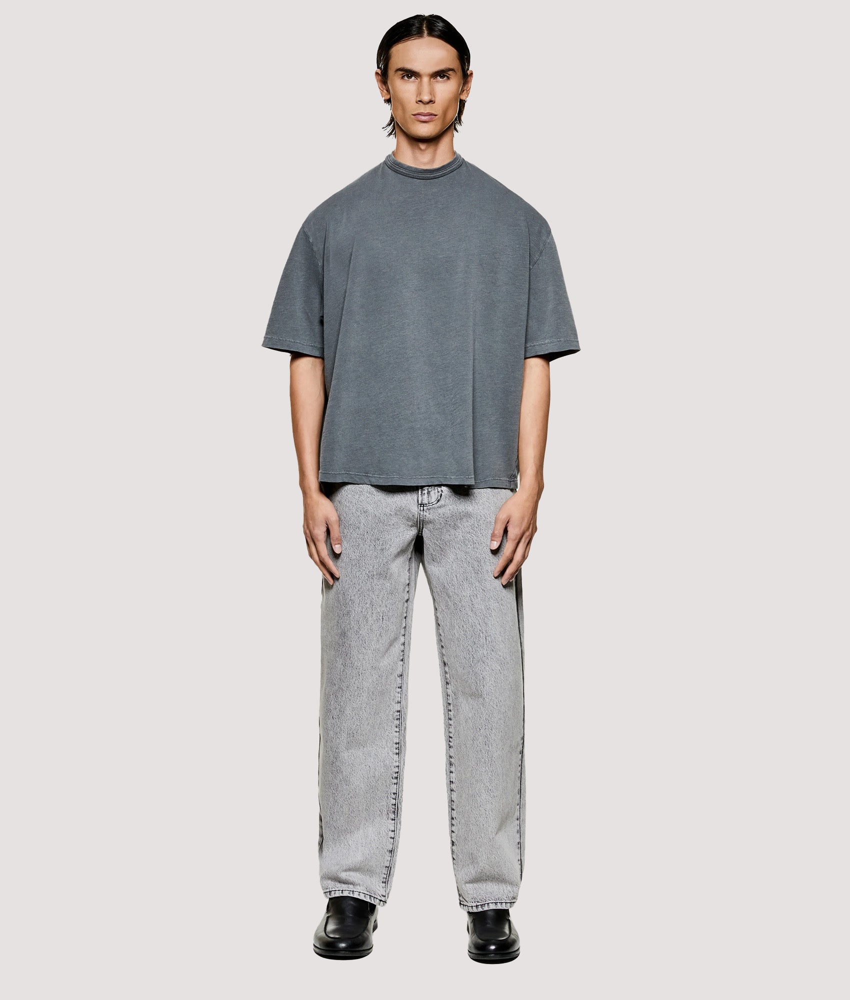 MKI MIYUKI ZOKU Box Fit 220 GSM Slub T-Shirt in Pigment Black at EQVVS Menswear. Model full front shot.