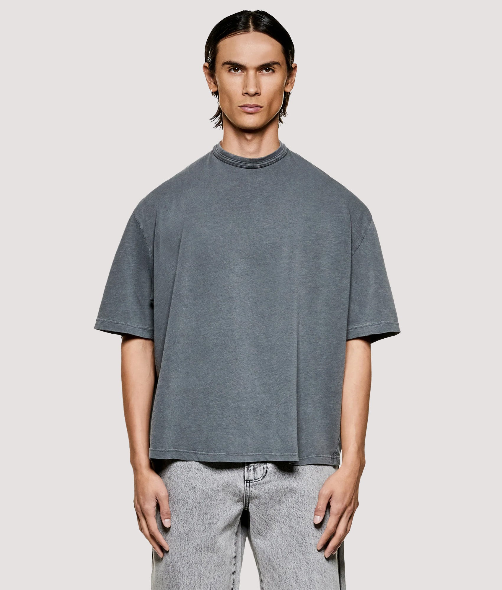 MKI MIYUKI ZOKU Box Fit 220 GSM Slub T-Shirt in Pigment Black at EQVVS Menswear. Model front shot.