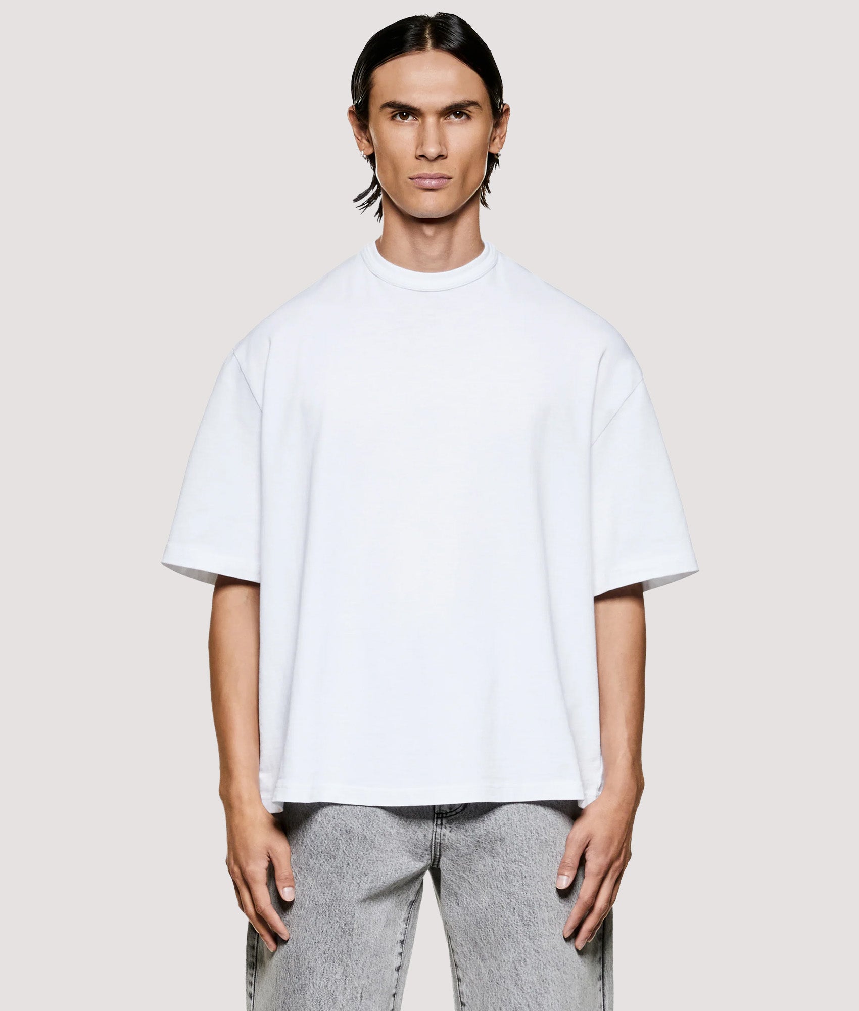 MKI MIYUKI ZOKU Box Fit 220 GSM Slub T-Shirt in White at EQVVS Menswear. Model front shot.
