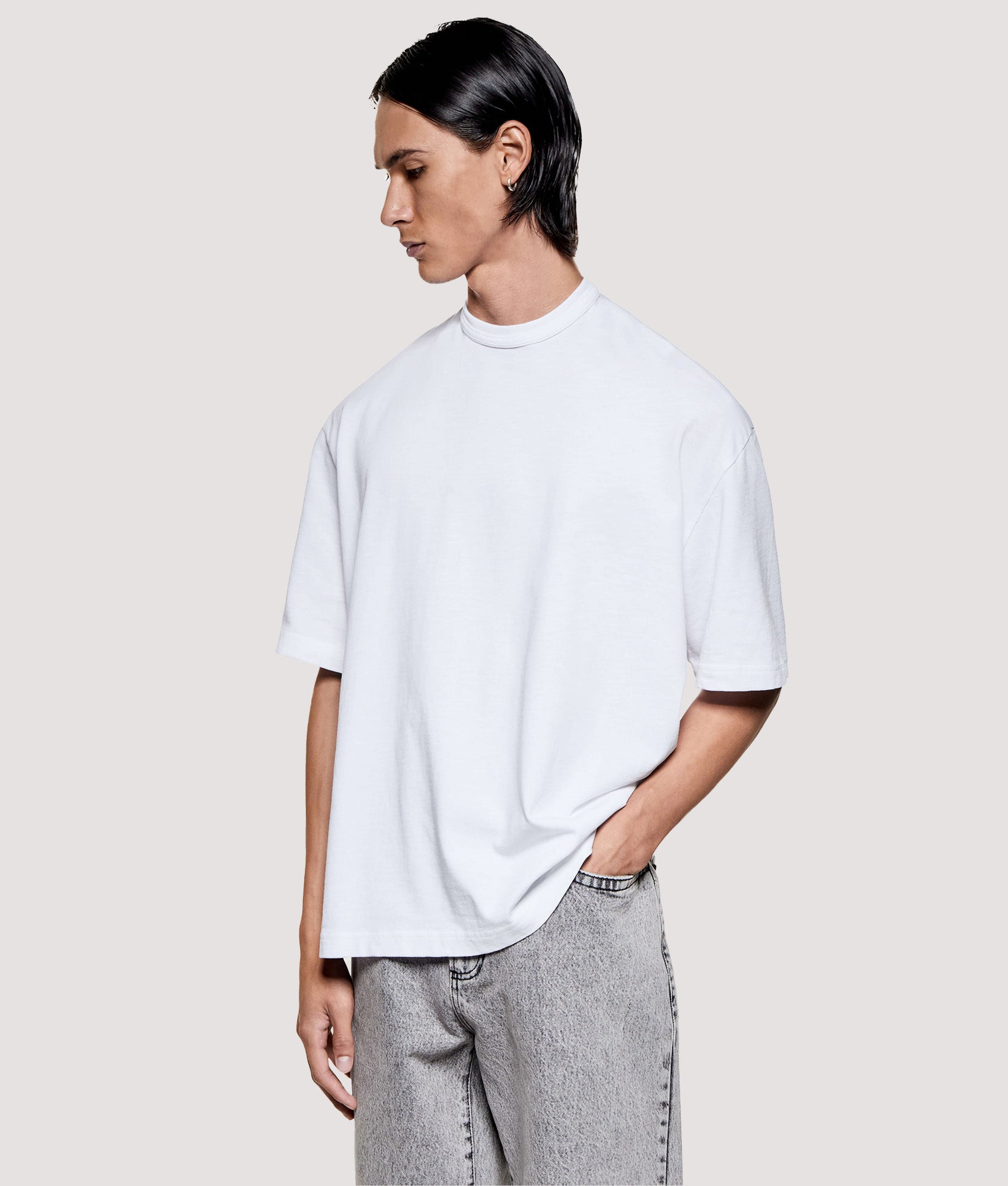MKI MIYUKI ZOKU Box Fit 220 GSM Slub T-Shirt in White at EQVVS Menswear. Angled model front shot.