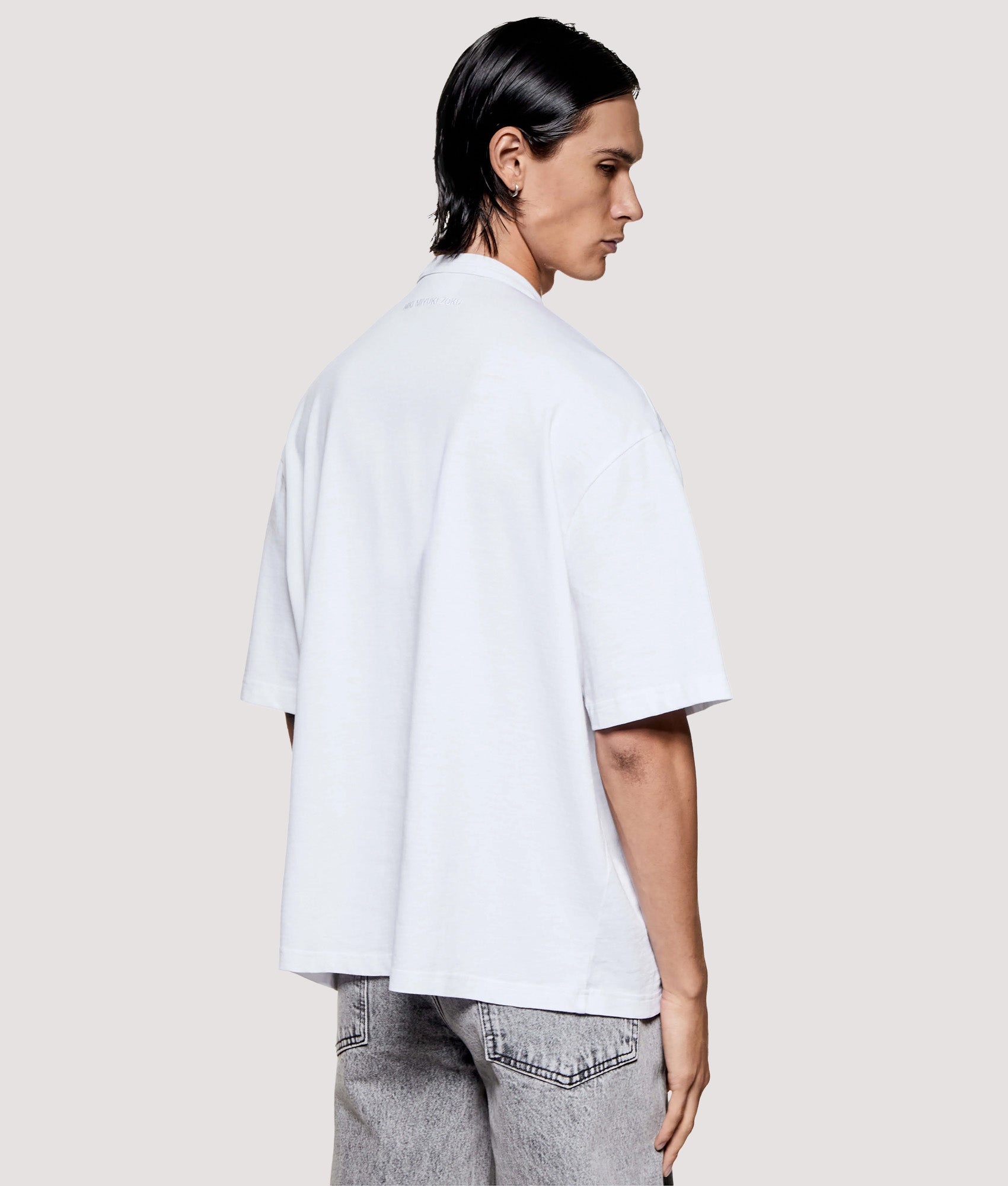 MKI MIYUKI ZOKU Box Fit 220 GSM Slub T-Shirt in White at EQVVS Menswear. Angled model back shot.