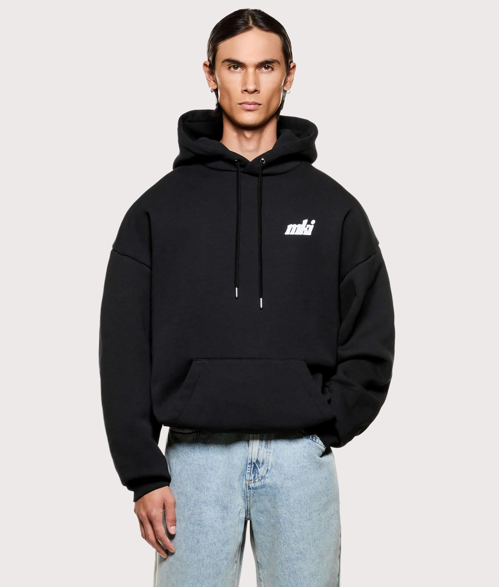 MKI MIYUKI ZOKU Stamp Hoodie in Black at EQVVS Menswear. Model front shot.