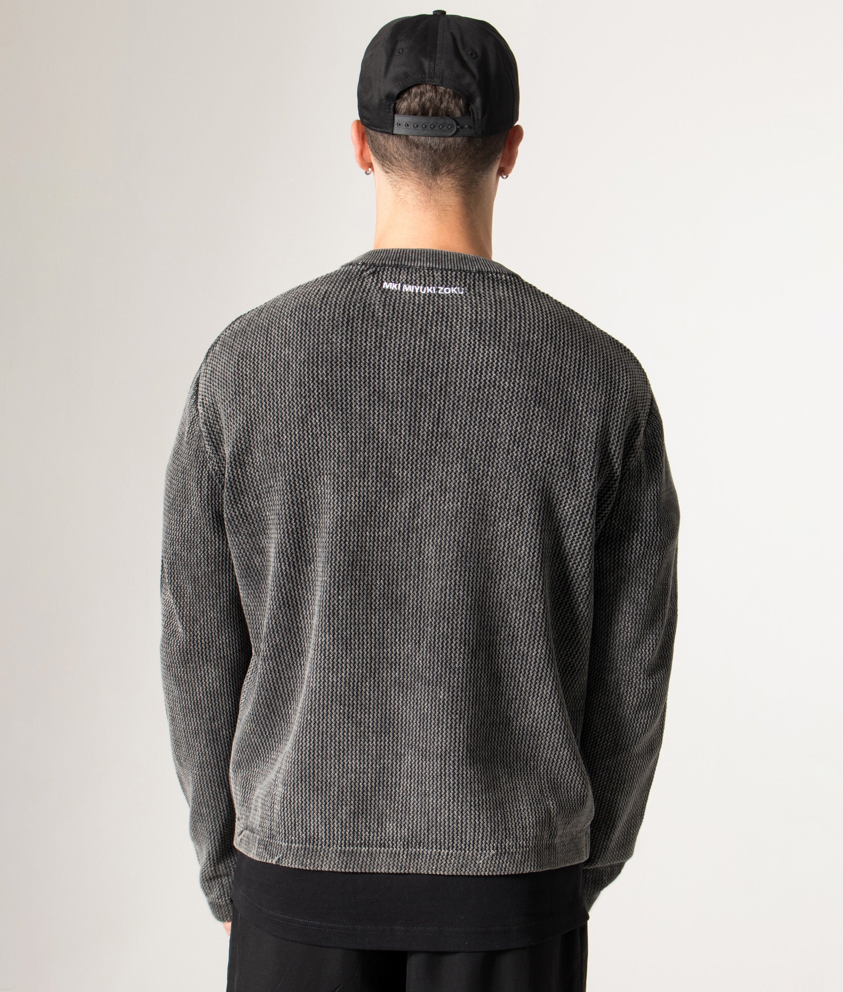 Pigment Dyed Loose Gauge Long Sleeve T-Shirt in Pigment Black. 100% Cotton | MKI MIYUKI ZOKU | Shot at EQVVS | Back model shot 