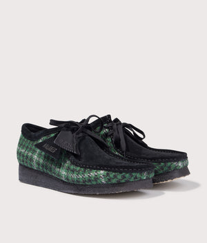 Wallabee by Clarks in Green Tweed. Shot by EQVVS. Front detail shot.