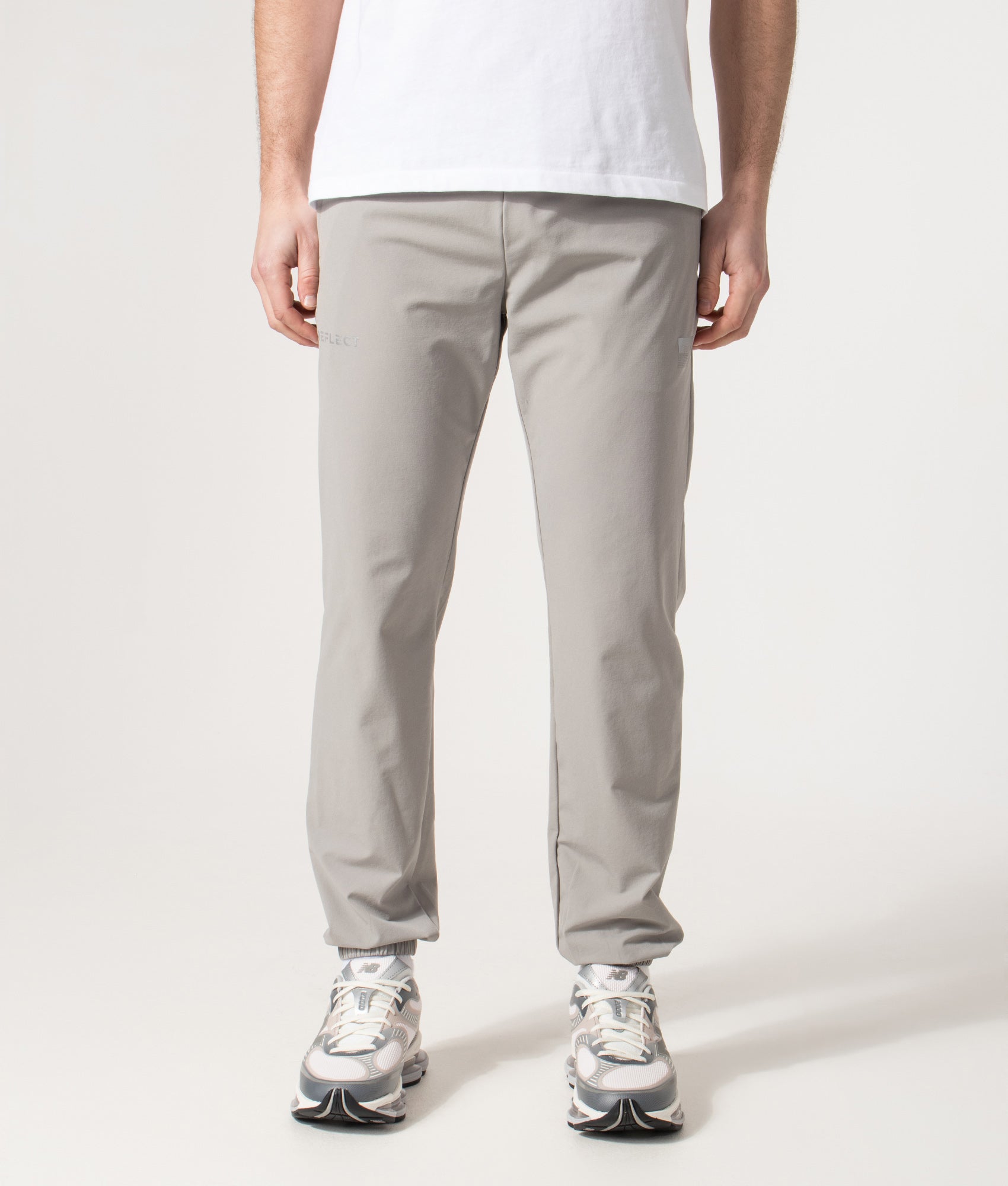 REFLECT Woven Track Pants in Grey at EQVVS Menswear. Model front shot.