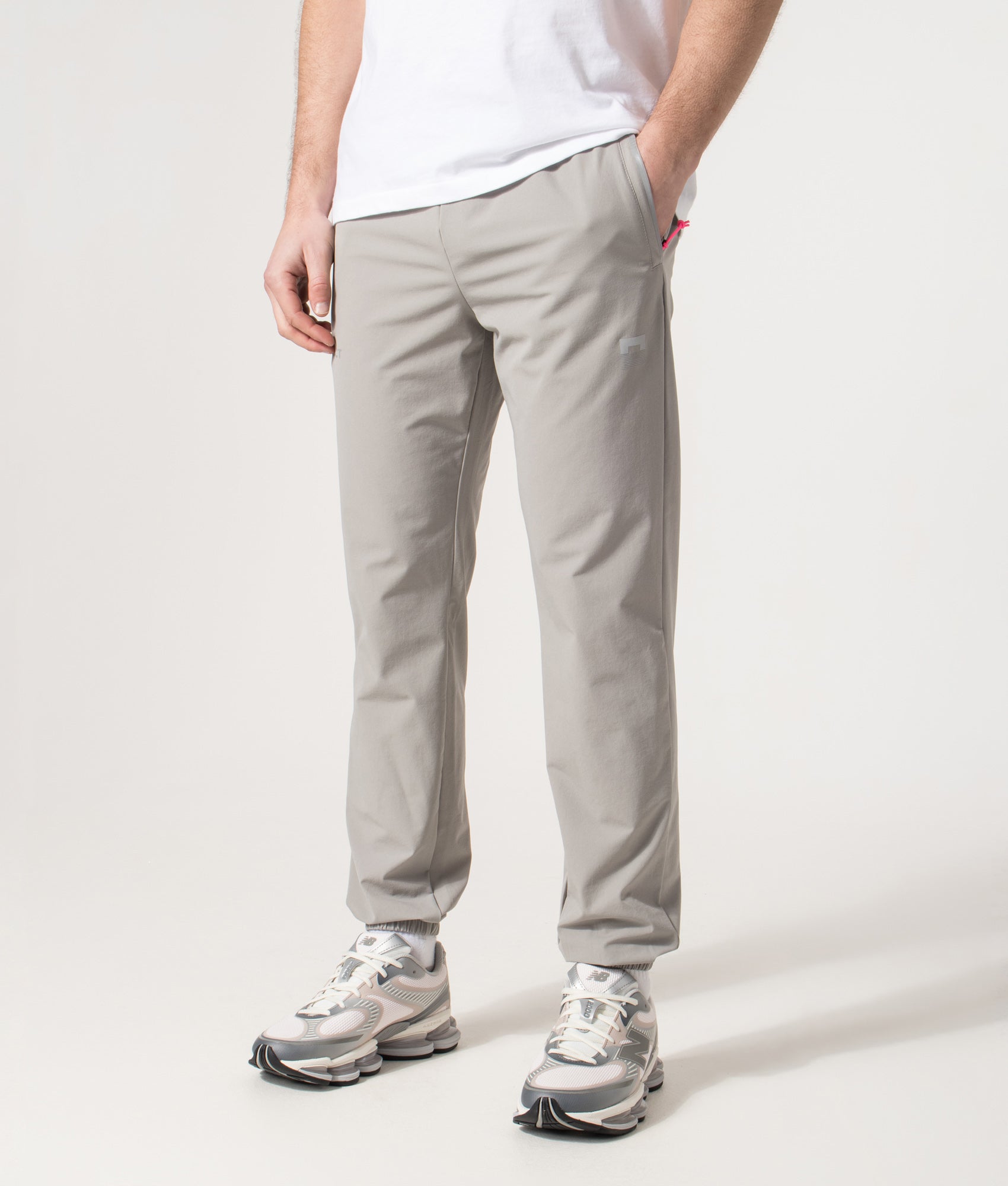 REFLECT Woven Track Pants in Grey at EQVVS Menswear. Angled model front shot.