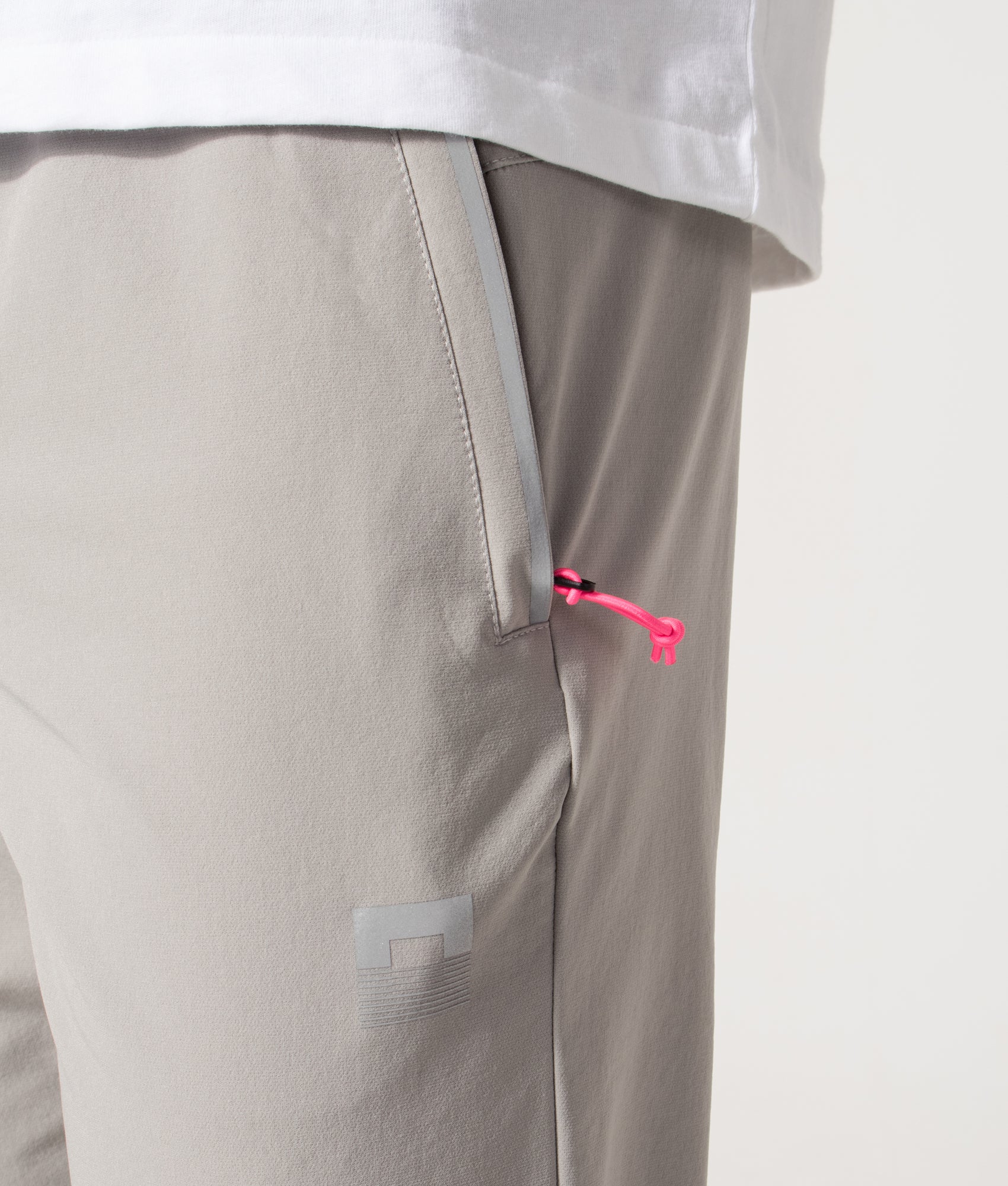 REFLECT Woven Track Pants in Grey at EQVVS Menswear. Detail shot.